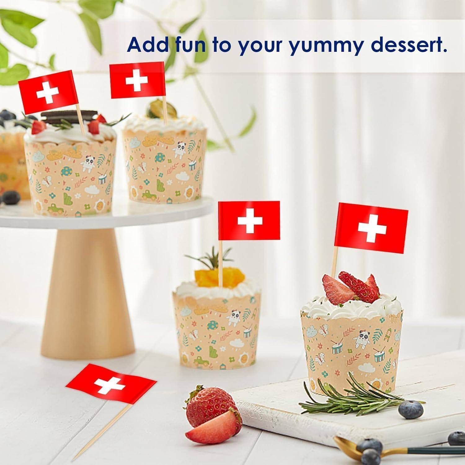 Cupcakes, die mit Schweizer Flaggen und bunten Streuseln verziert sind. Text darüber liest sich: „Fügen Sie Ihrem leckeren Dessert Spaß hinzu.