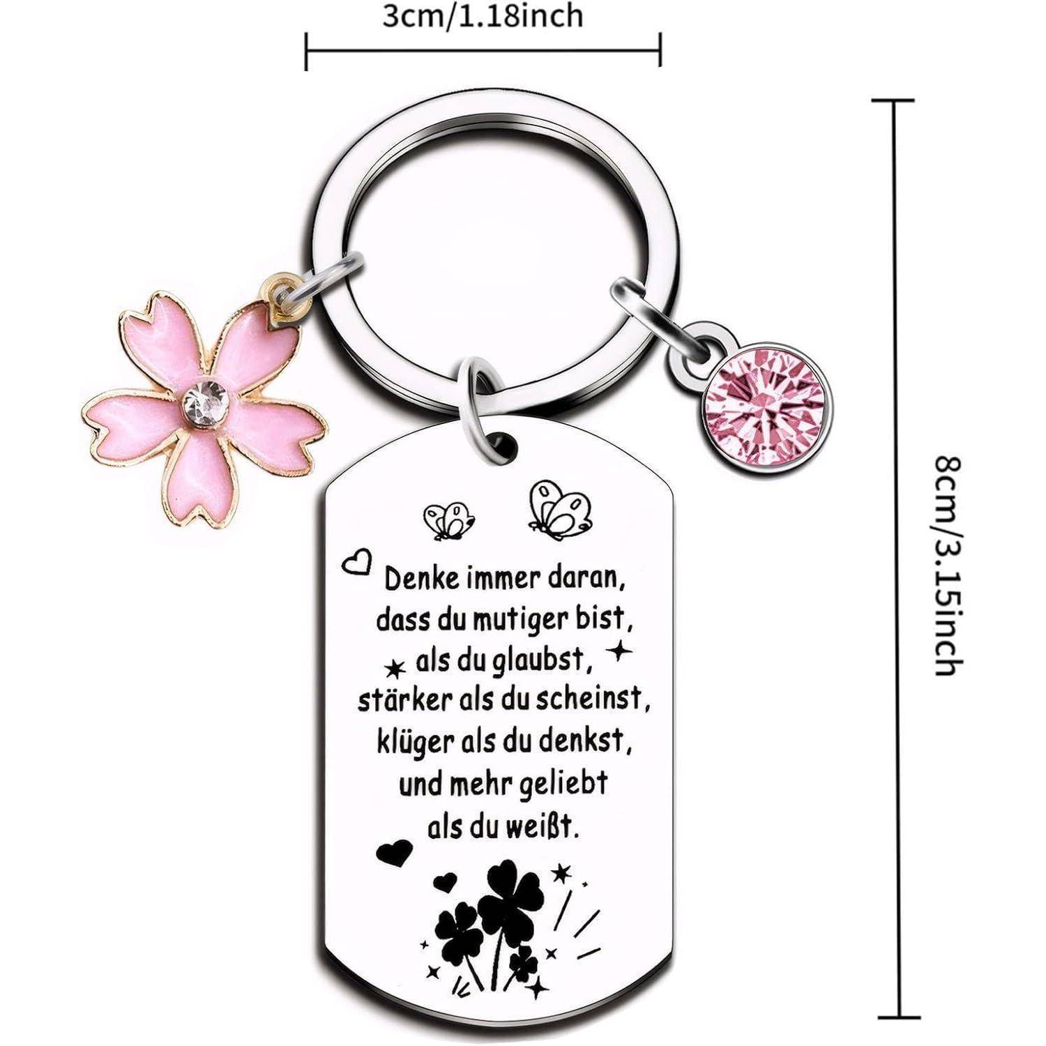 Schlüsselanhänger mit Herz- und Blumenanhängern, versehen mit einer deutschen Inschrift über Mut, Kraft, Weisheit und Liebe, geschmückt mit Schmetterlingen und Herzen.