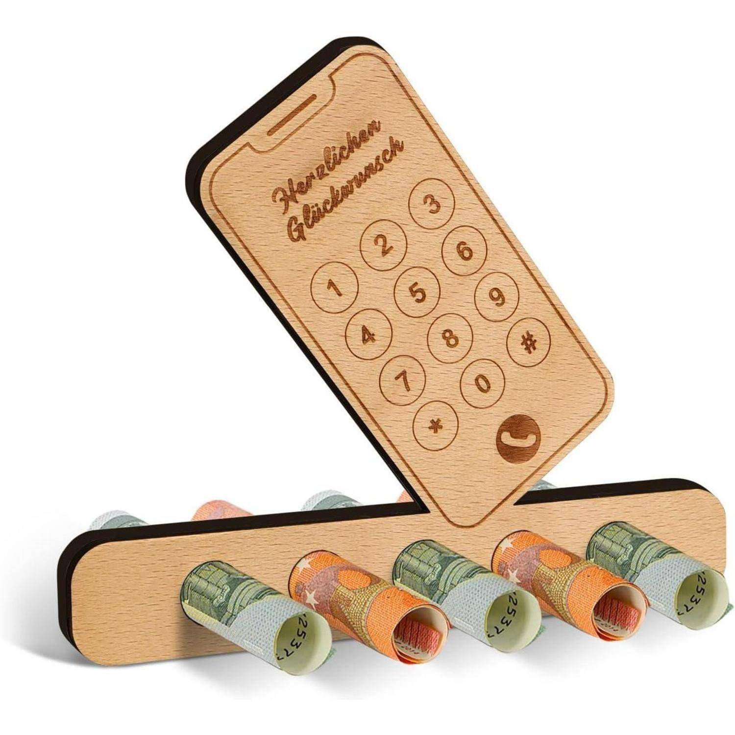 Ein hölzerner, telefonförmiger Halter mit den Worten 'Herzlichen Glückwunsch', der aufgerollte Geldscheine hält.