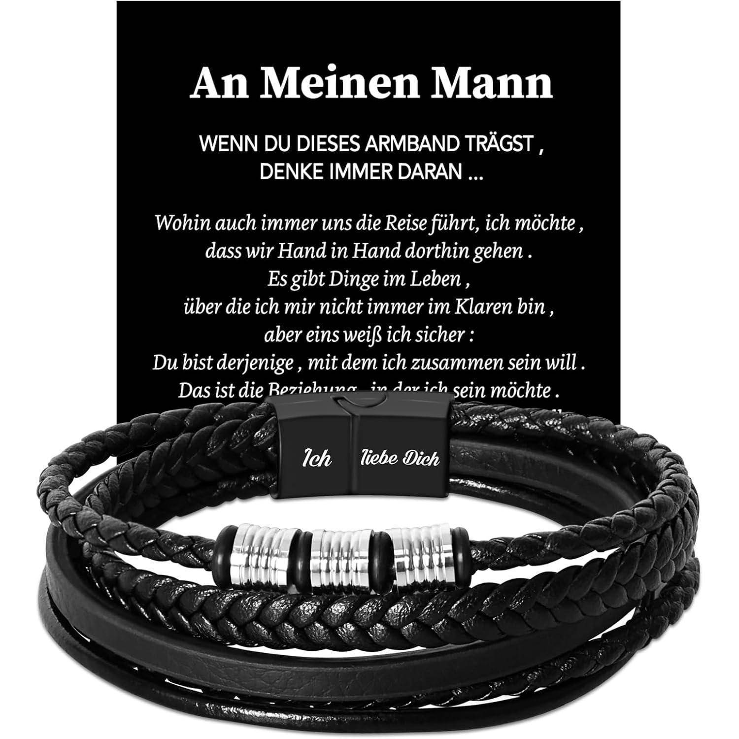 Ein geflochtenes schwarzes und silbernes Armband mit einer Nachricht auf Deutsch auf einer Karte dahinter. Die Karte enthält eine liebevolle Botschaft an einen Partner.
