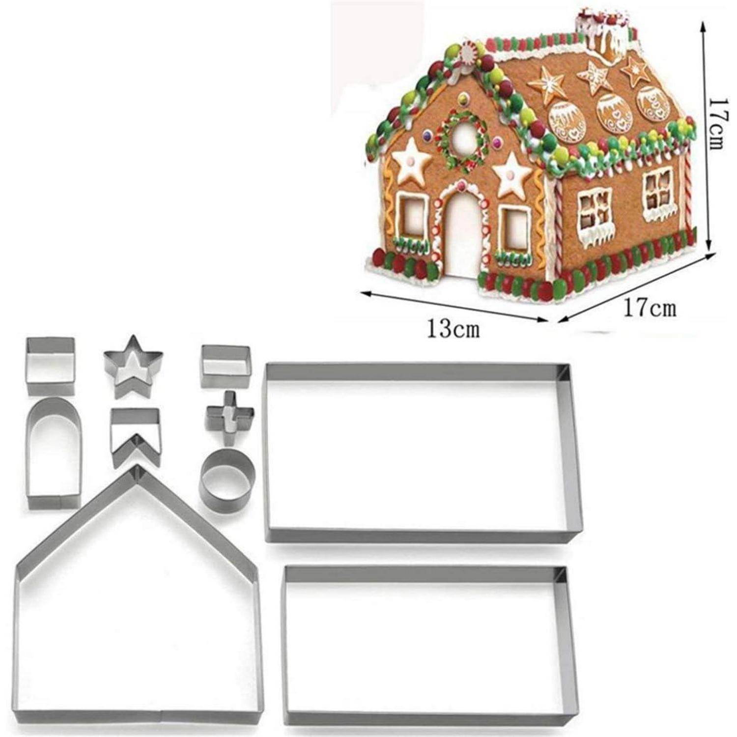 Lebkuchenhaus mit farbiger Zuckerguss-Verzierung und Süßigkeiten-Dekorationen. Set aus Metallplätzchenausstecher: verschiedene Formen zum Konstruieren des Hauses.