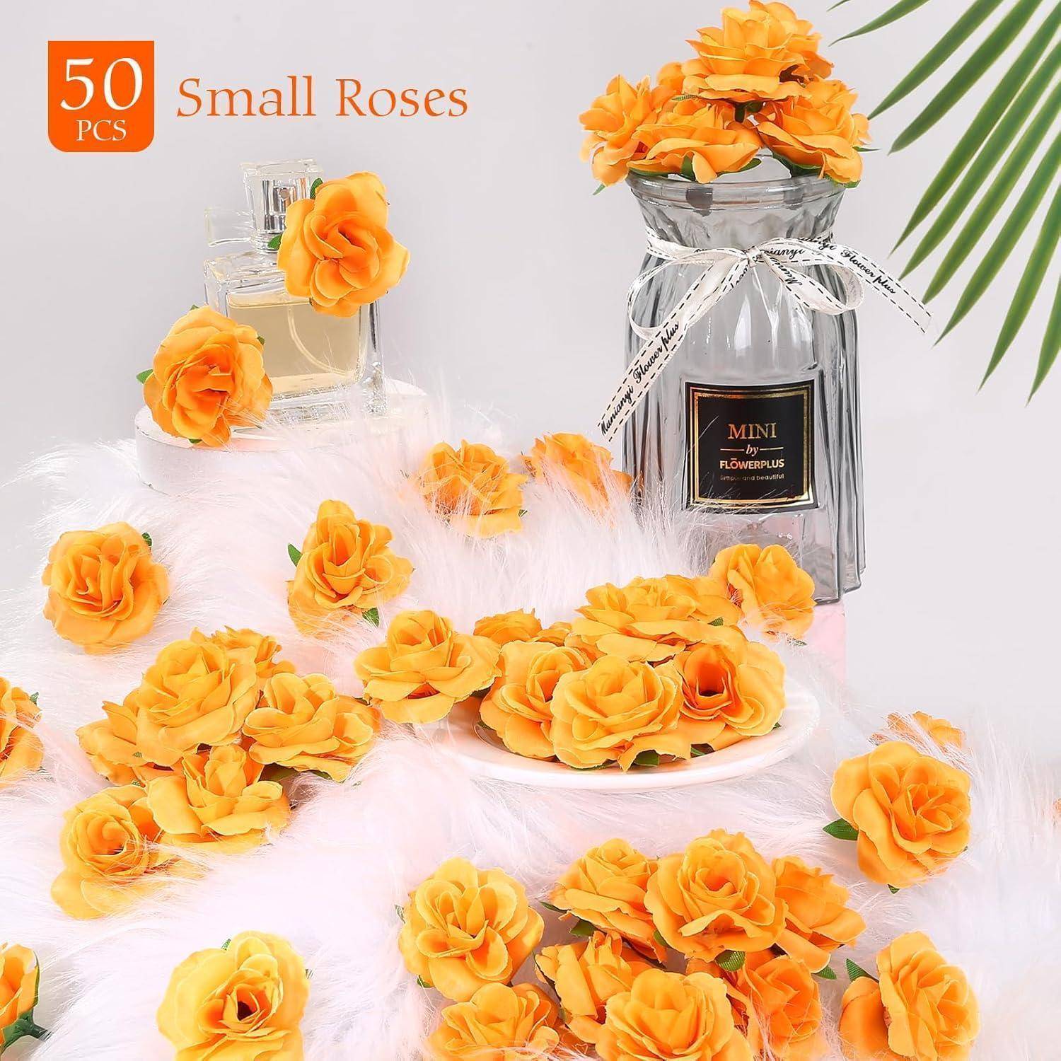 Eine Anordnung von künstlichen orangefarbenen Rosen mit einer Beschriftung von 50 Stück, neben einer Parfümflasche und einem 