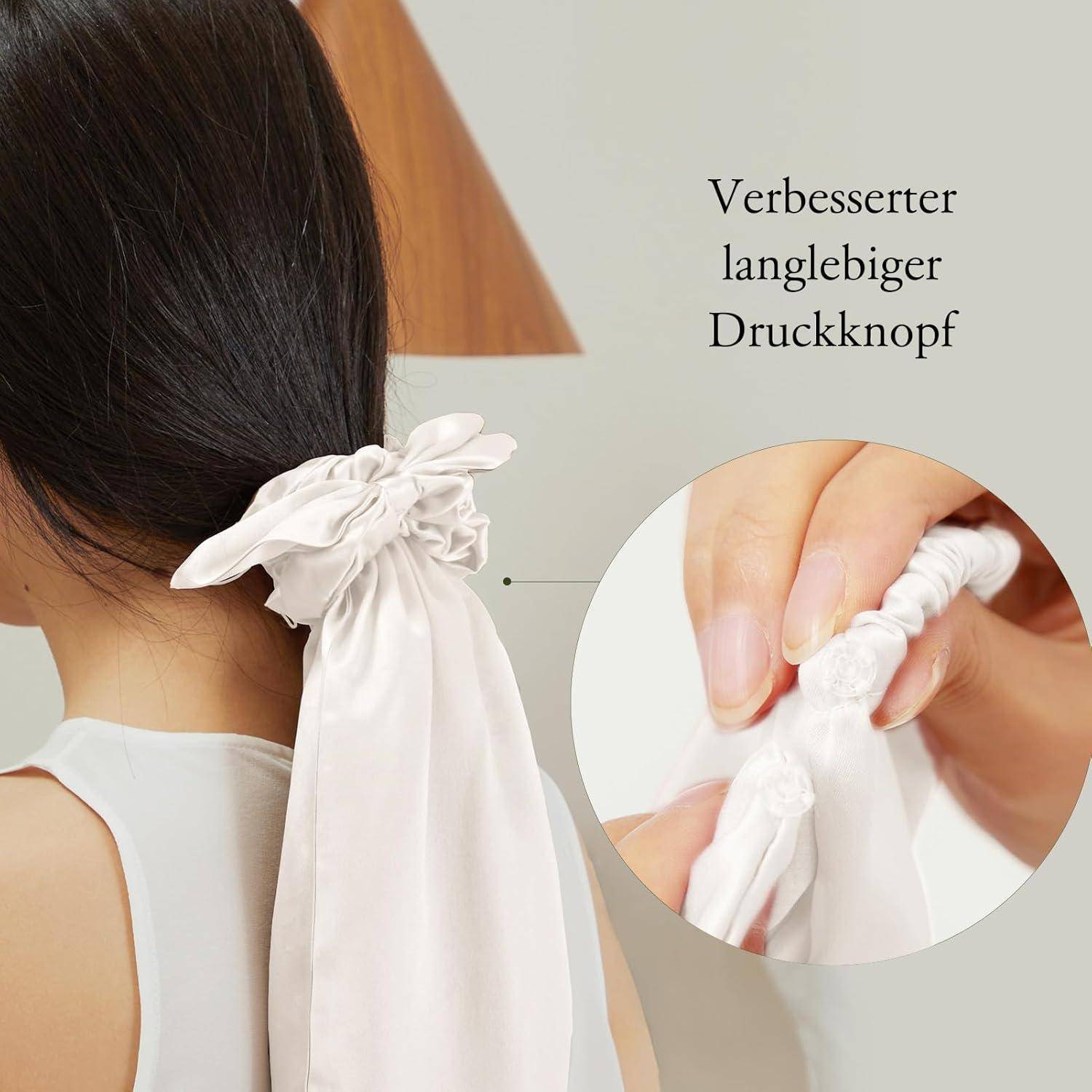 Eine Person mit langen Haaren wird von hinten gezeigt, die einen weißen Satin-Haarband mit einer Schleife trägt. Das Einsatzfoto hebt einen robusten Druckknopf hervor.