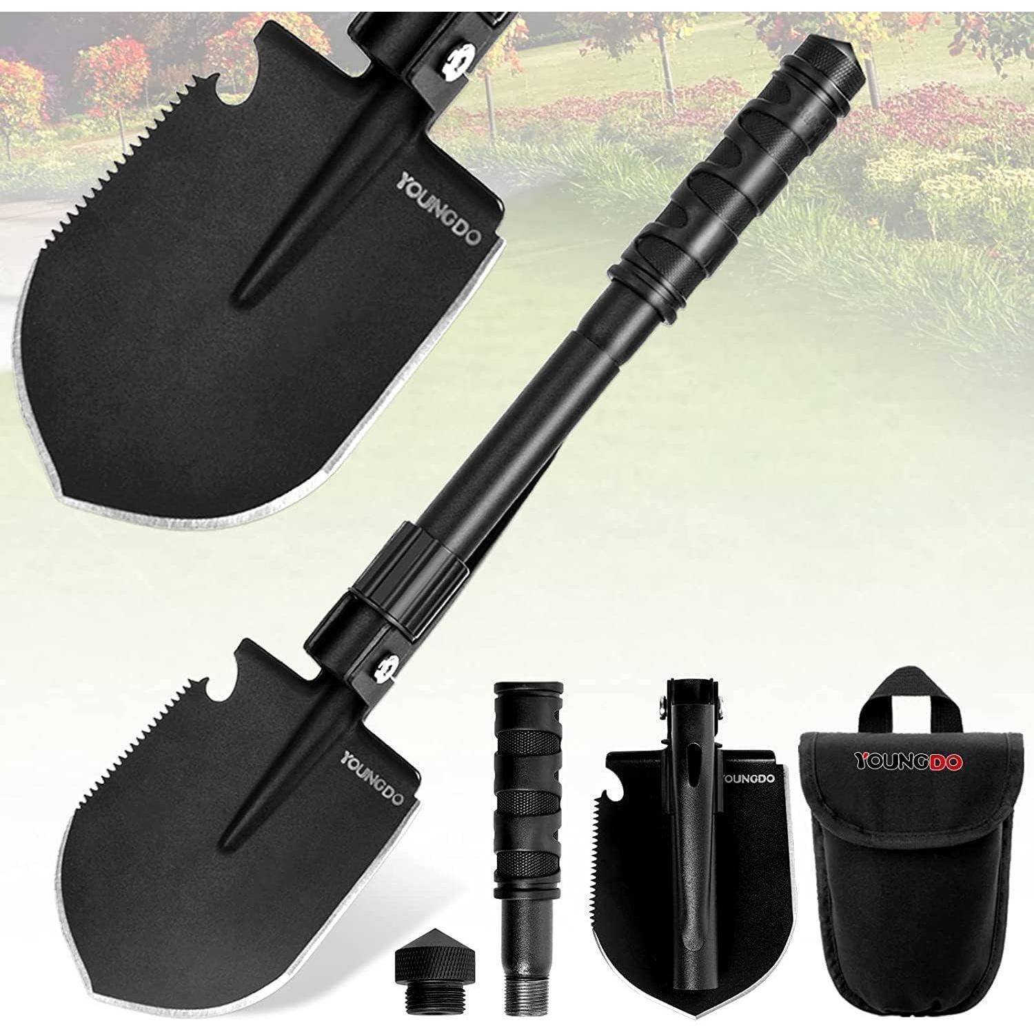 Ein multifunktionales schwarzes Schaufelset, das zerlegt dargestellt wird: Schaufelkopf, Griff, Verlängerungsrohre und Transporttasche, vor einem Gartenhintergrund.