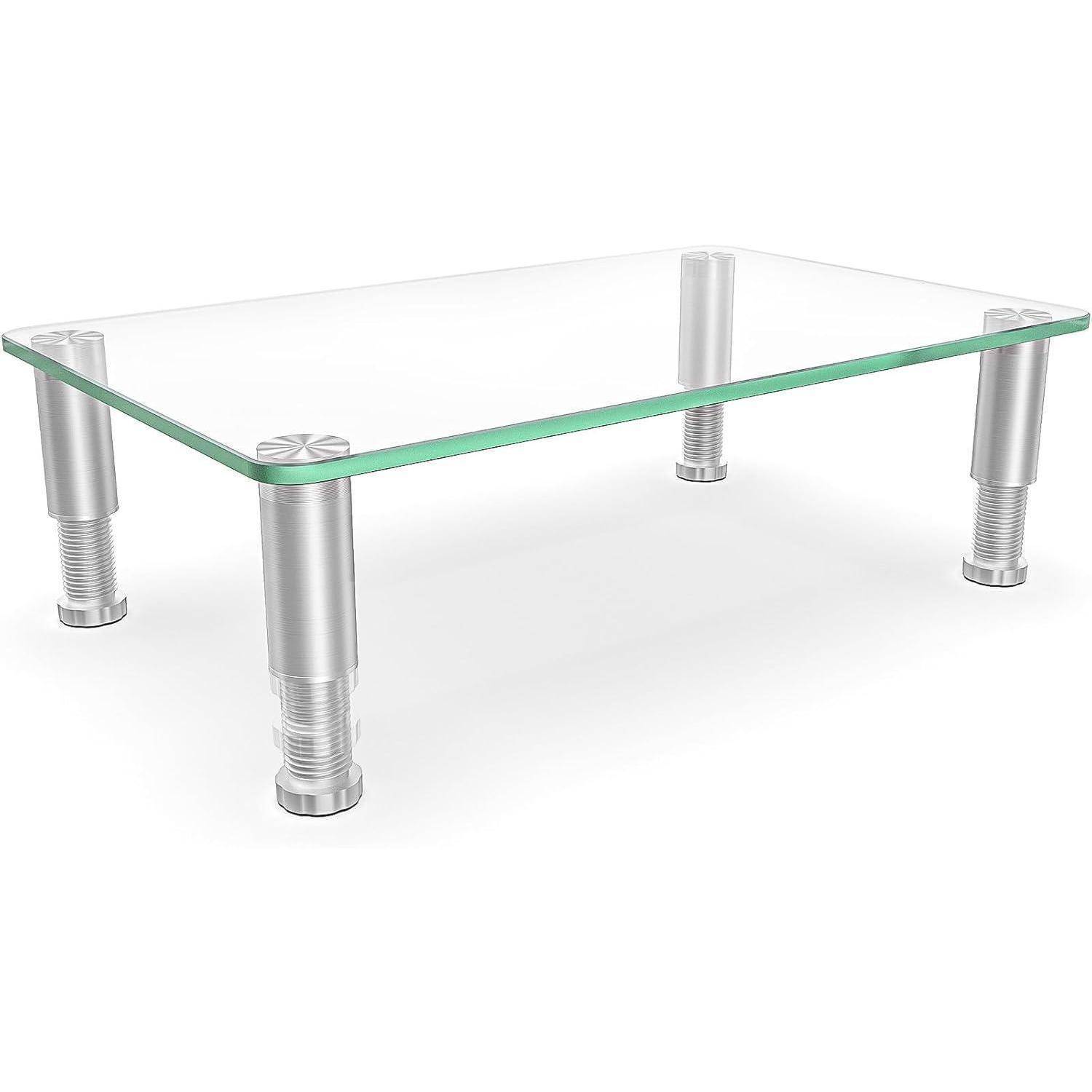 Ein rechteckiger Glasschreibtischständer mit vier zylindrischen Metallbeinen, konzipiert zur ergonomischen Erhöhung von Monitoren oder Laptops.
