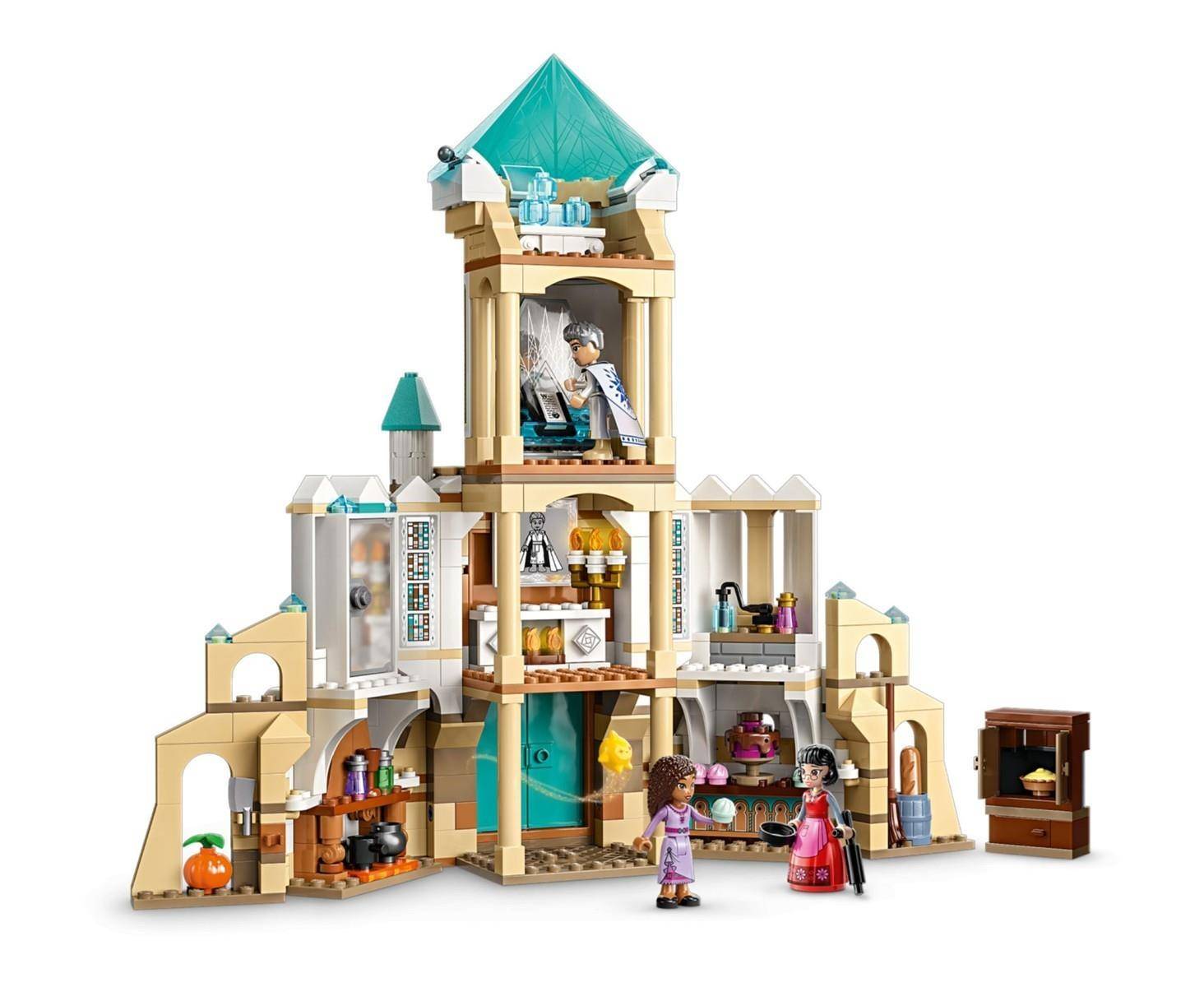 Spielzeugschloss-Set mit mehreren Zimmern und zwei Mini-Puppenfiguren davor, gezeigt als detailliertes Gebäude-Set auf weißem Hintergrund.