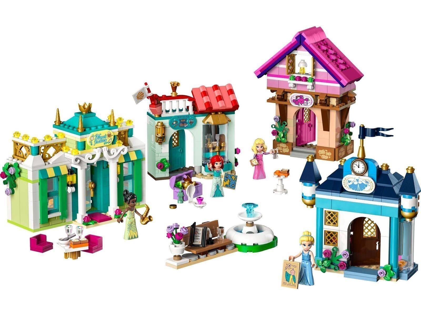 Bild von mehreren farbenfrohen LEGO-ähnlichen Mini-Puppenhaus-Szenen und Landschaften mit kleinen Prinzessinnenfiguren, arrangiert auf weißem Hintergrund.