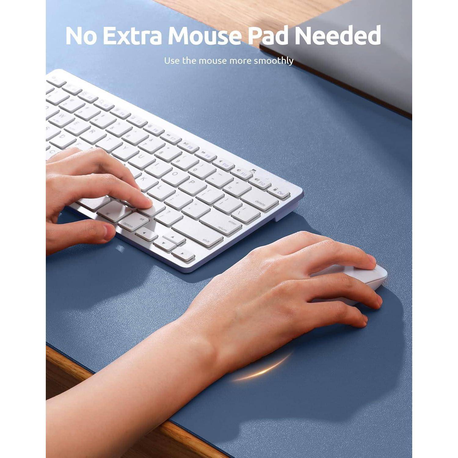 Hände, die eine Tastatur und Maus auf einer glatten Schreibtischoberfläche verwenden, mit dem Text 