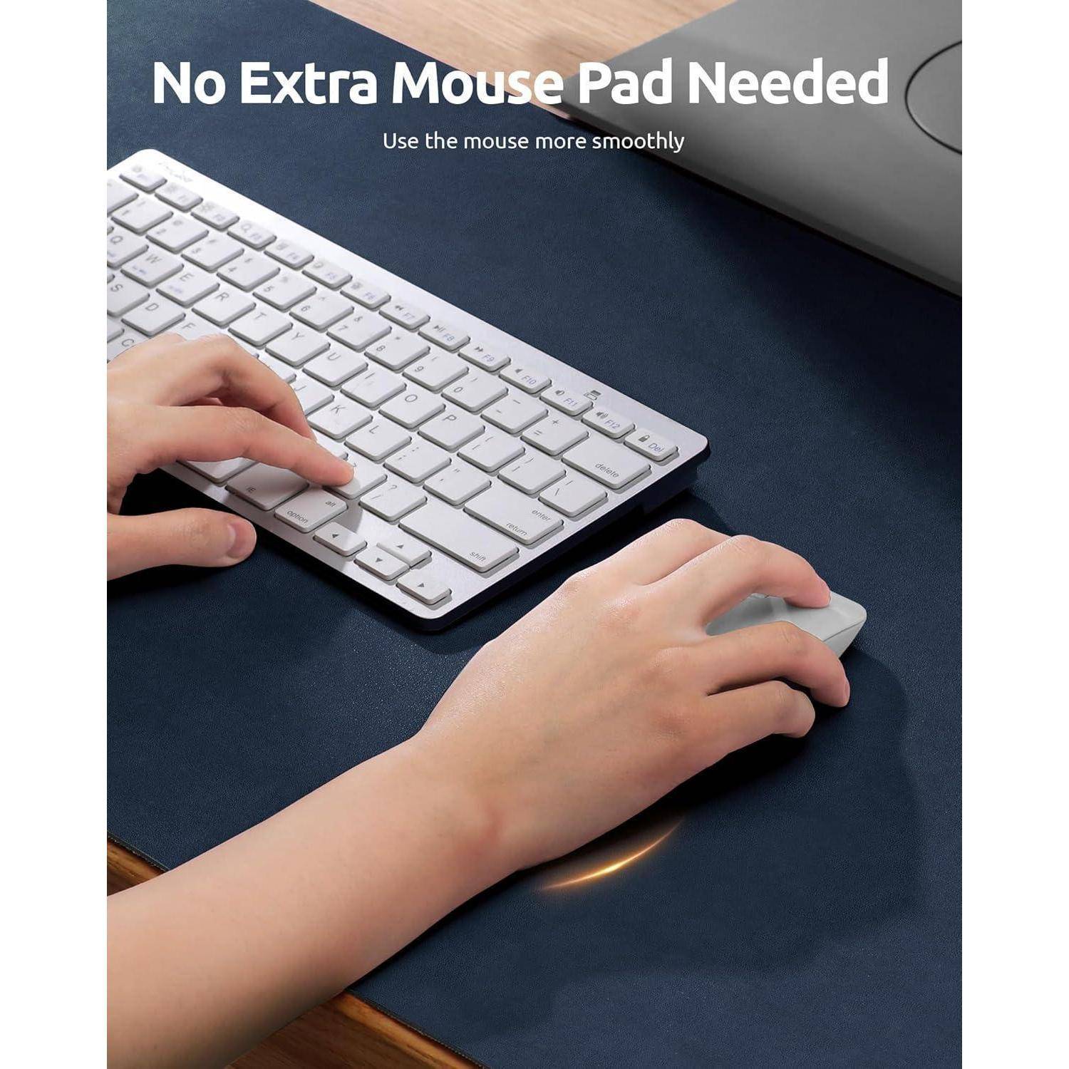 Eine Person, die eine kabellose Maus auf einer Schreibtischmatte verwendet, die gleichzeitig als Mousepad dient, mit einer Tastatur in der Nähe. Text liest sich: Kein zusätzliches Mousepad erforderlich.