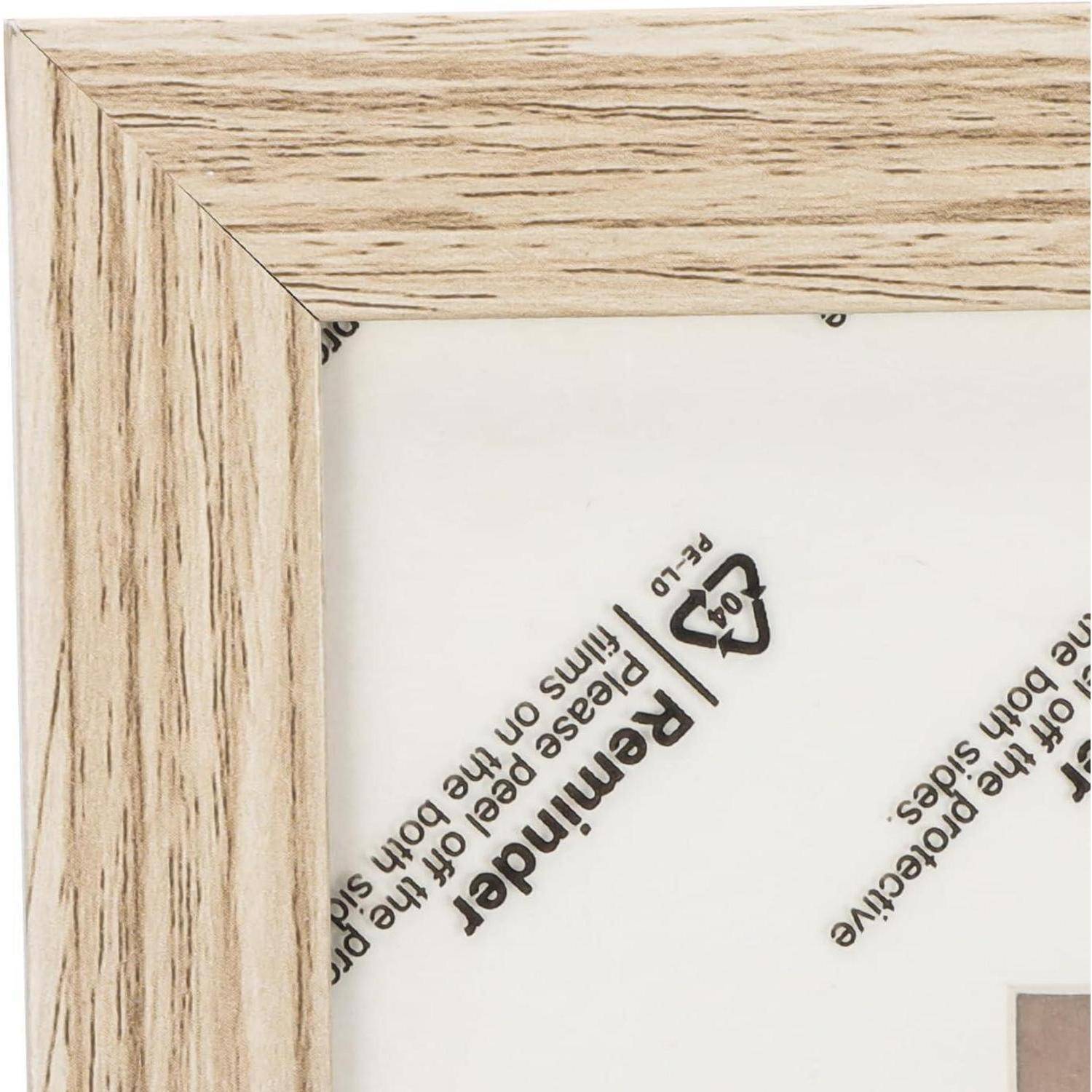Eine Nahaufnahme einer Ecke eines hellholzfarbenen Rahmens zeigt Innentext und Symbole wie 'Remind' und ein Recycling-Logo.