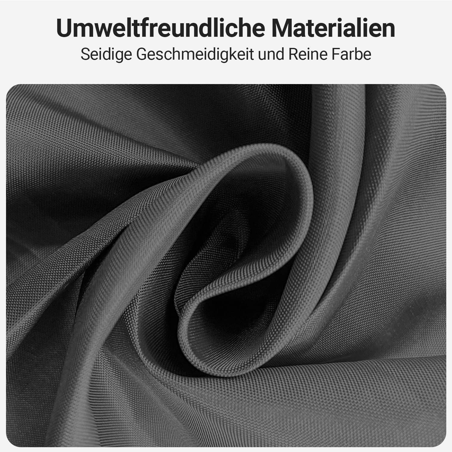 Close-up einer grauen Stoffspirale mit Text, der 'Umweltfreundliche Materialien Seidige Geschmeidigkeit und Reine Farbe' liest und dabei umweltfreundliche und seidig-glatte Eigenschaften hervorhebt.