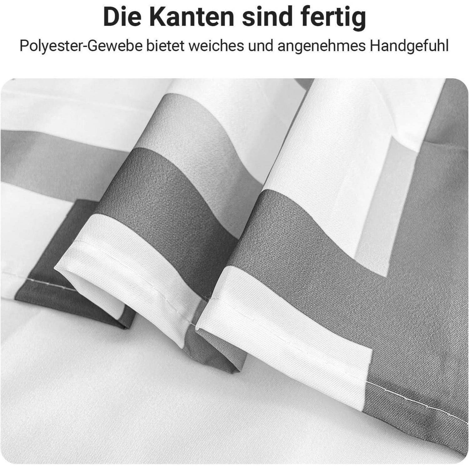 Eine Nahaufnahme von gefaltetem grau und weiß gestreiftem Polyesterstoff, die seine weiche und angenehme Textur betont. Deutscher Text lautet: 