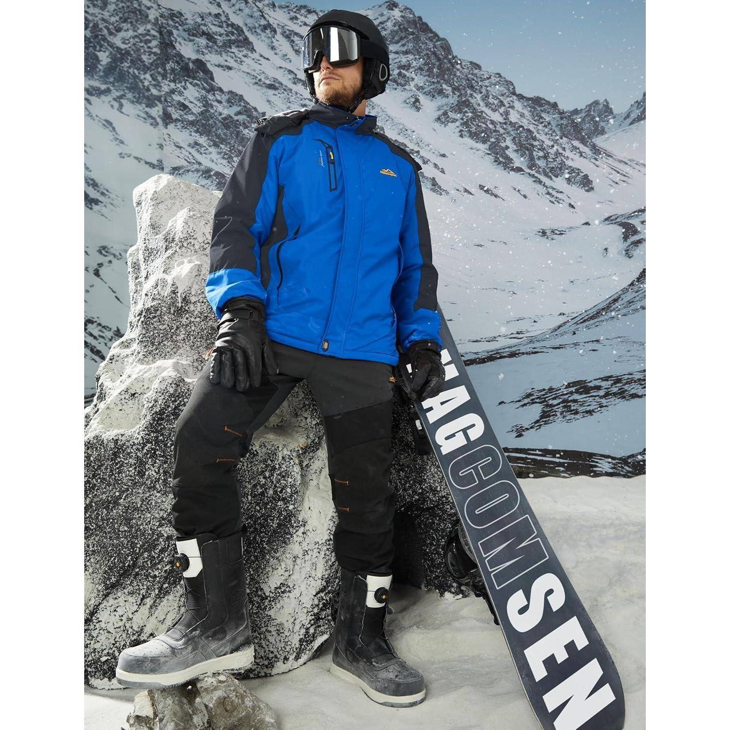 Eine Person in Winterausrüstung steht auf schneebedecktem Terrain mit einem Snowboard, umgeben von Bergen, was eine für das Snowboarden ideale Umgebung vermittelt.