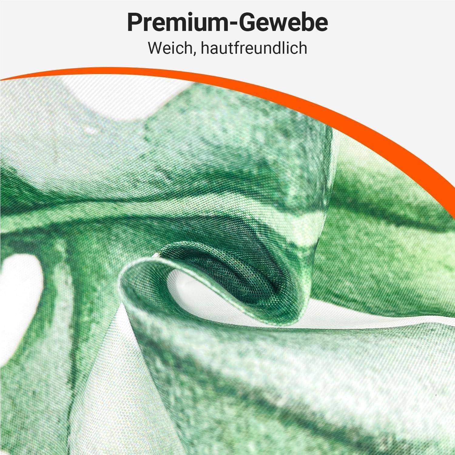 Nahaufnahme von grünem Stoff mit der Aufschrift 'Premium-Gewebe, Weich, hautfreundlich', die die weiche, hautfreundliche Textur hervorhebt.