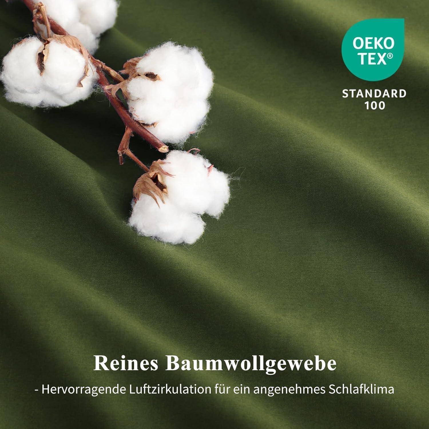 Zweig mit Baumwollbollen auf grünem Stoff. Text: 'Reines Baumwollgewebe - Hervorragende Luftzirkulation für ein angenehmes Schlafklima'. Oeko-Tex Standard 100 Logo.