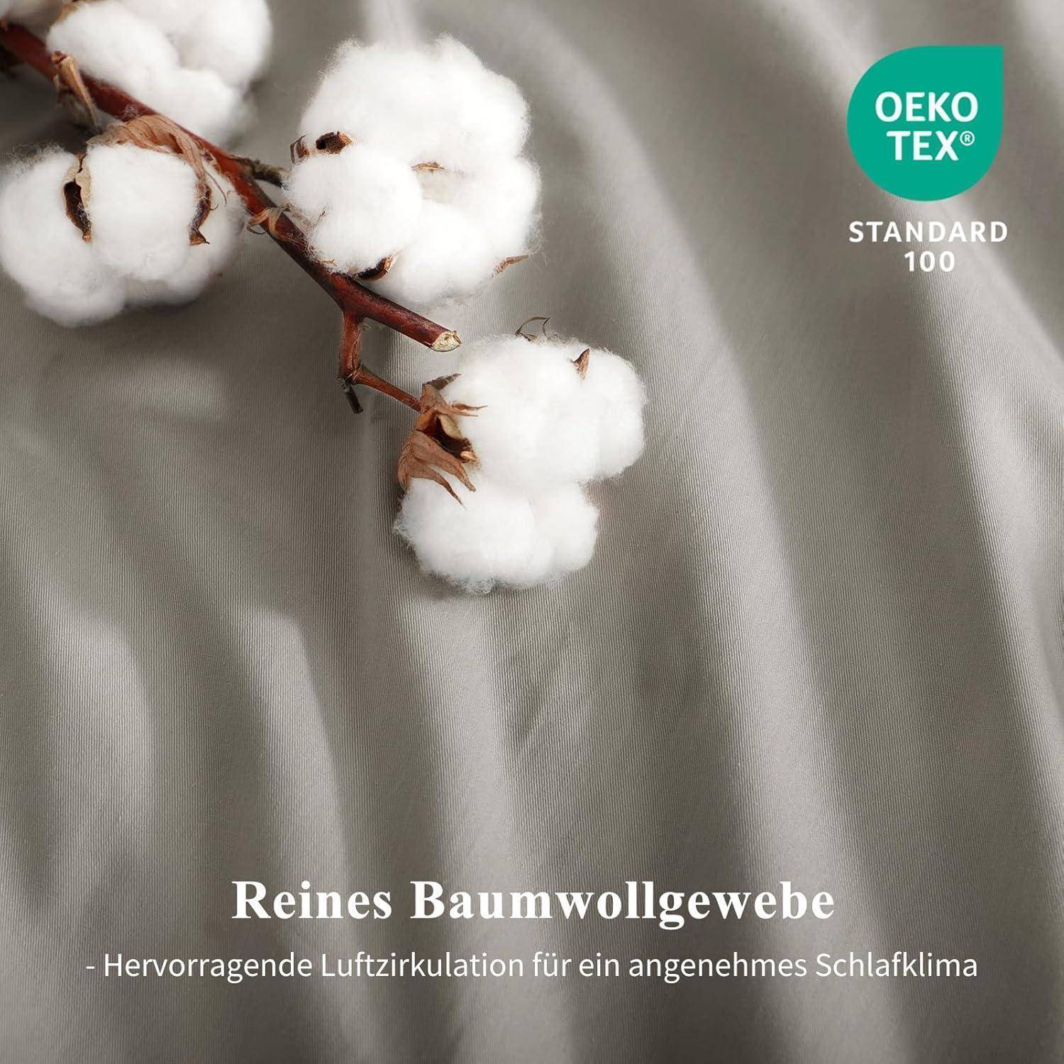Wattebausch auf Stoff mit dem Text 'OEKO-TEX STANDARD 100' und 'Reines Baumwollgewebe - Hervorragende Luftzirkulation für ein angenehmes Schlafklima'.