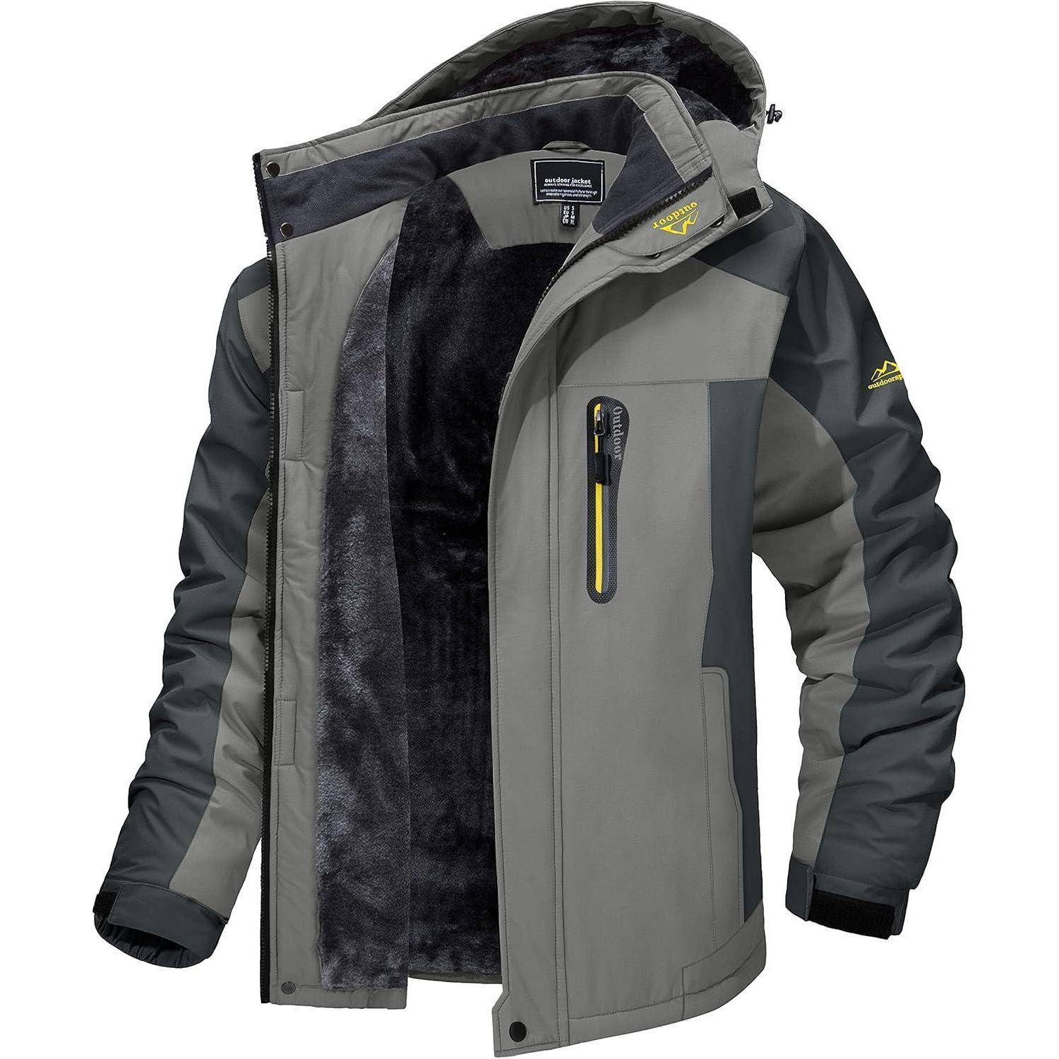 Ein hellgrauer Wintermantel mit dunklen Ärmeln und einem schwarzen Fleece-Futter. Mit Reißverschluss vorne, Taschen-Details und verstellbaren Manschetten.