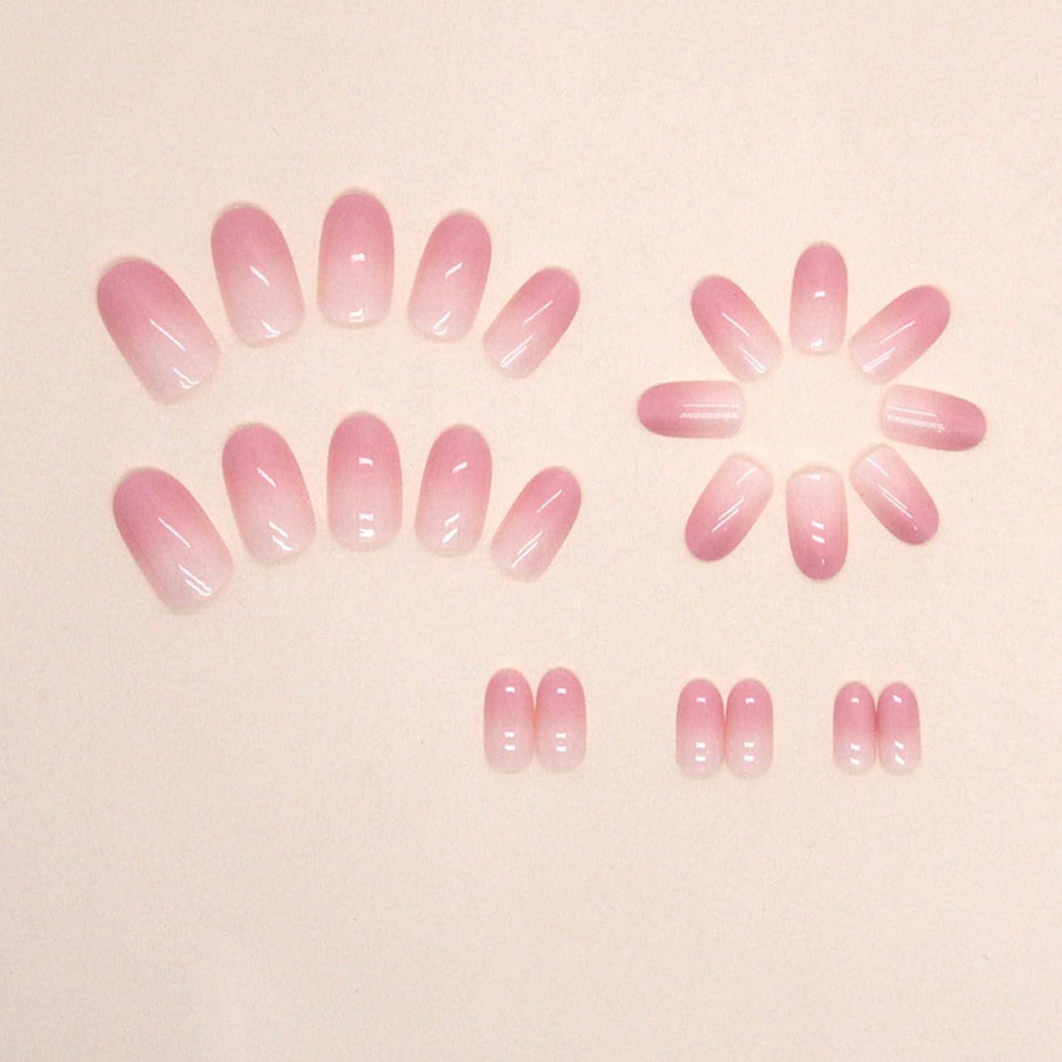 Ein Set pinker Ombré-Künstliche Nägel, nach Größe angeordnet und zwei Halbkreise bildend. Die Nägel verlaufen farblich von einem hellen Rosa zu einem tieferen Pink an den Spitzen.