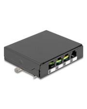 Ein kleiner schwarzer Netzwerk-Switch mit vier Ethernet-Anschlüssen, die jeweils mit Nummern beschriftet sind.
