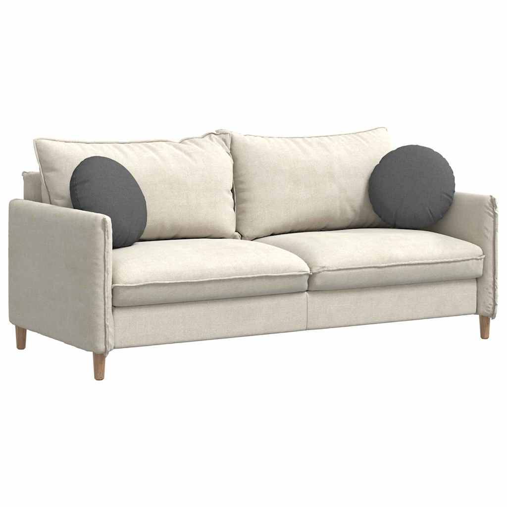 Ein hellbeiger, zweisitziger Sofa mit Holzbeinen, ausgestattet mit zwei dunkelgrauen runden Kissen. Das Sofa besitzt ein minimalistisches, modernes Design.