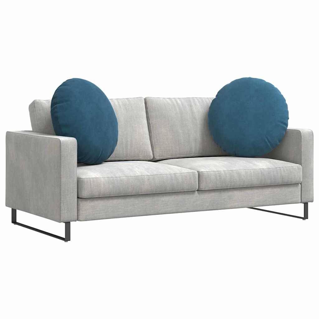 Ein modernes graues Sofa mit zwei großen runden blauen Kissen auf jeder Ecke, ausgestattet mit minimalistischen Metallfüßen, ideal für zeitgenössische Wohnräume.