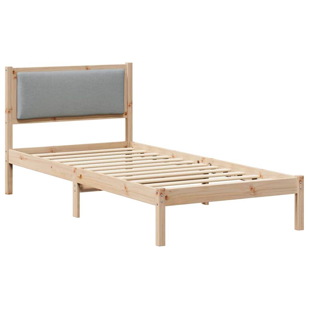 Ein Holz-Einzelbettgestell mit einer hellgrauen gepolsterten Kopfstütze, Lattenrost und minimalistischem Design. Ohne Matratze.