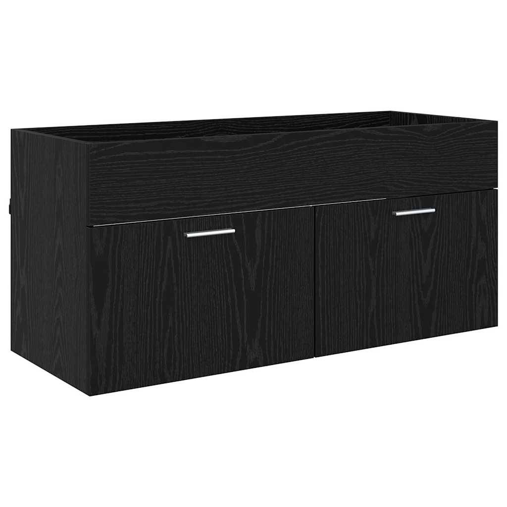 Ein schwarzer Holzwandschrank mit zwei herausziehbaren Griffen und einem rechteckigen Pflanzkasten oben darauf.