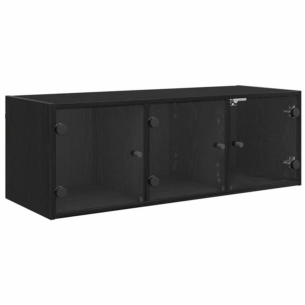 Eine schwarze, wandmontierte Aufbewahrungseinheit mit drei transparenten Glastüren und metallischen Griffen.