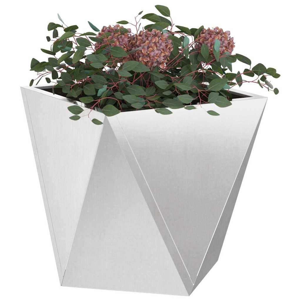 Ein geometrischer Metallpflanzer beherbergt üppiges grünes Blattwerk und Cluster rosafarbener Blüten und schafft damit einen modernen und eleganten Eindruck.