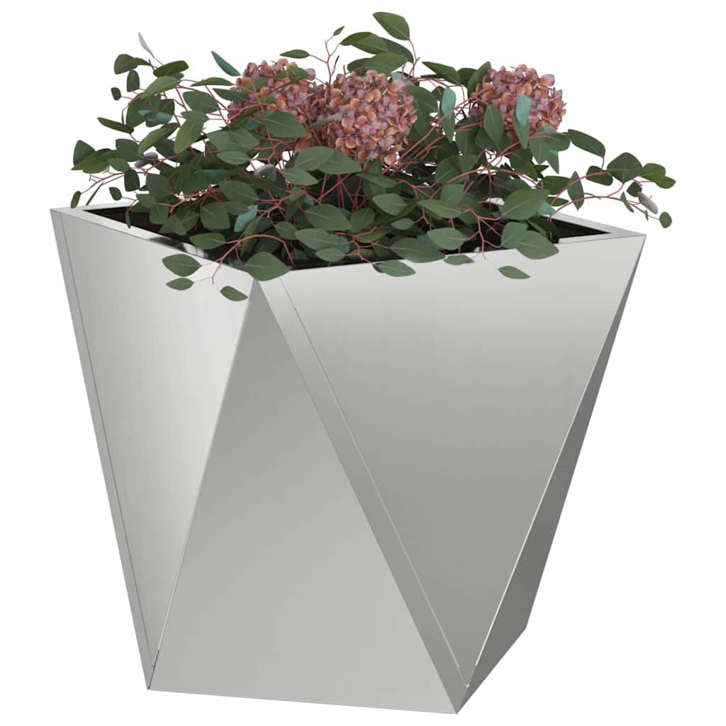 Ein silberner geometrischer Pflanzkübel mit lebhaften pinken Blumen und grünen Blättern, der dem Raum eine moderne und farbenfrohe Note verleiht.