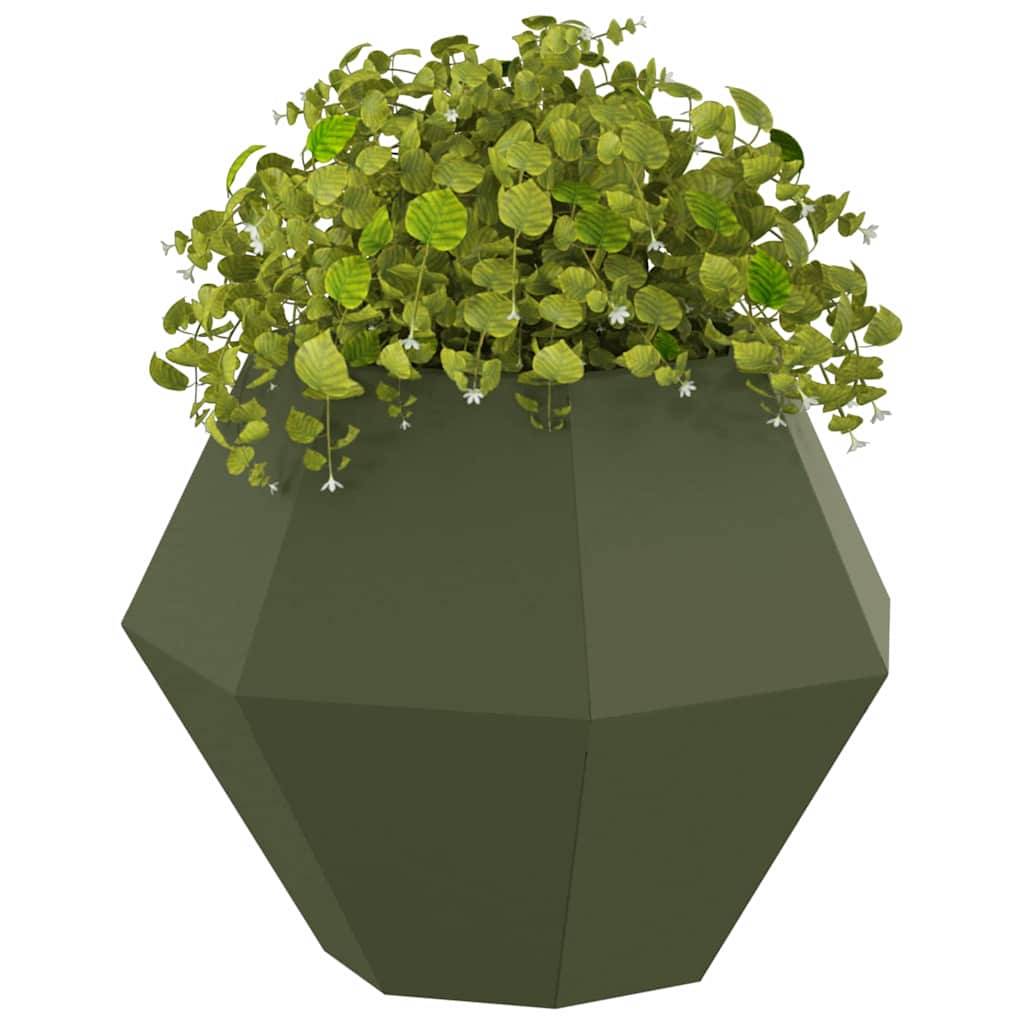Ein geometrischer, dunkelgrüner Topf beherbergt eine üppige Pflanze mit hängenden, kleinen, abgerundeten Blättern.