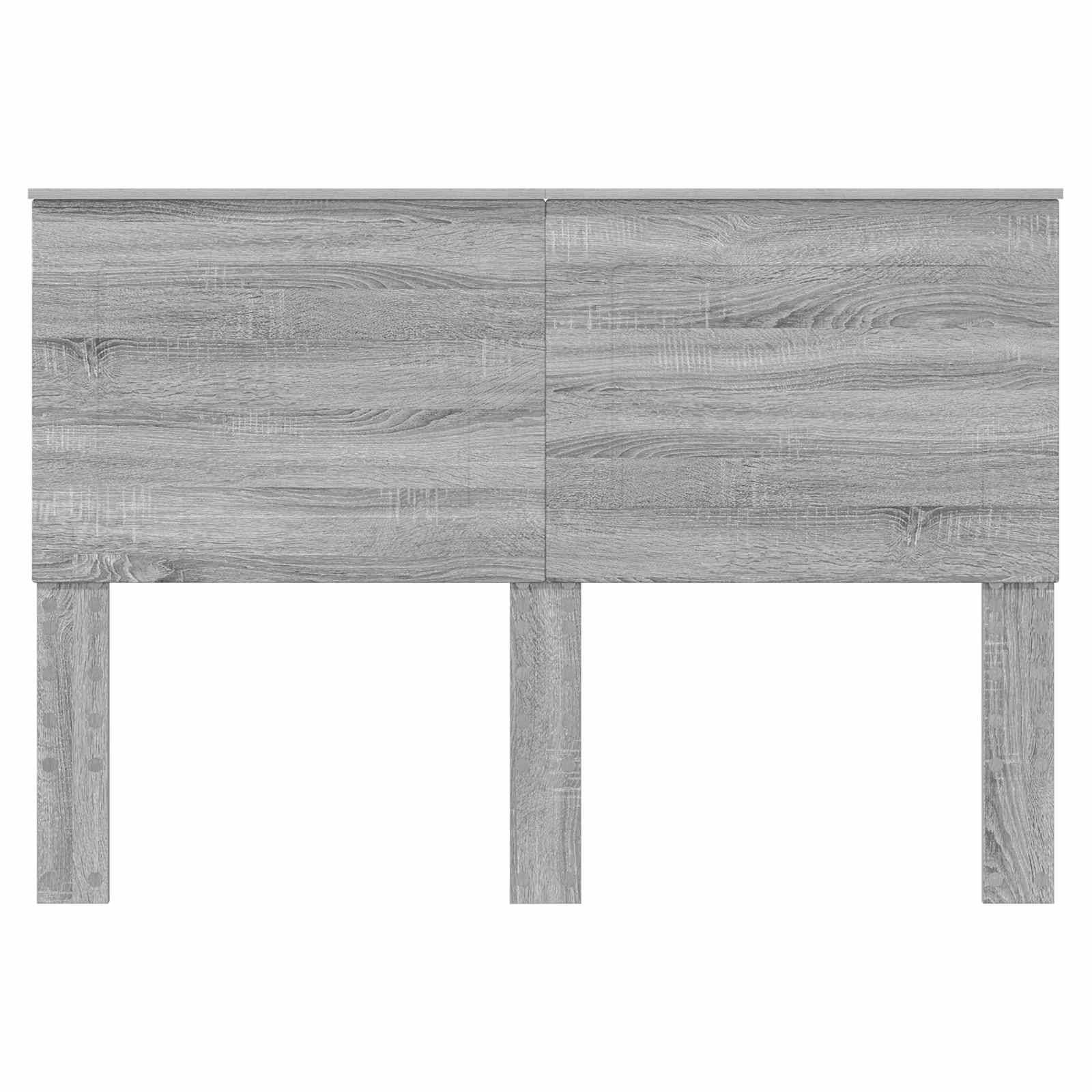 Ein Kopfbrett aus Holz mit minimalističhem Design, mit einer hellgrauen Oberfläche und Holzmaserung, gestützt durch drei vertikale Beine.
