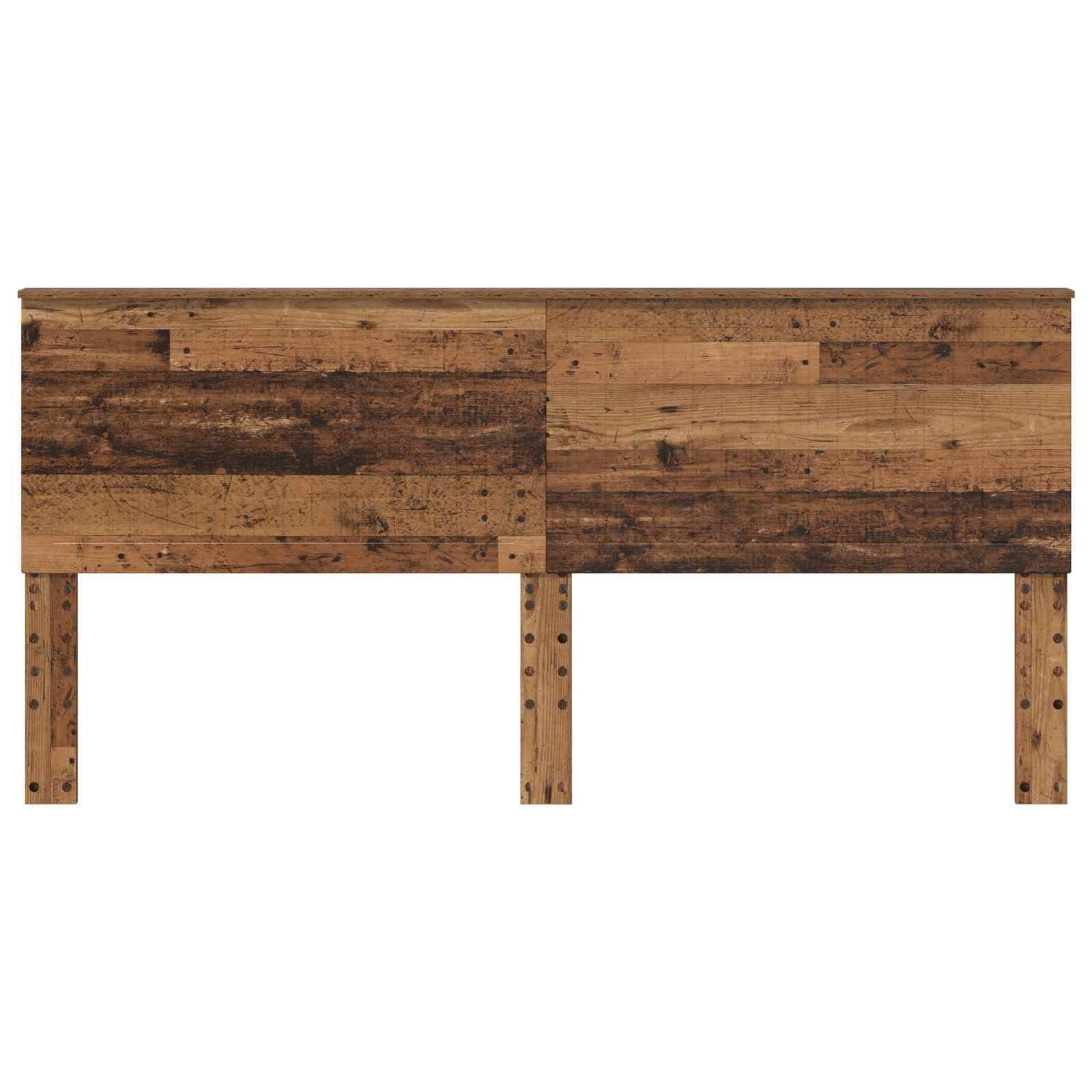 Ein Holzschreibtisch mit rustikaler Oberfläche, mit einer flachen Arbeitsplatte und vier stabilen Beinen, der eine Mischung aus dunklen und hellen Holztönen zeigt.