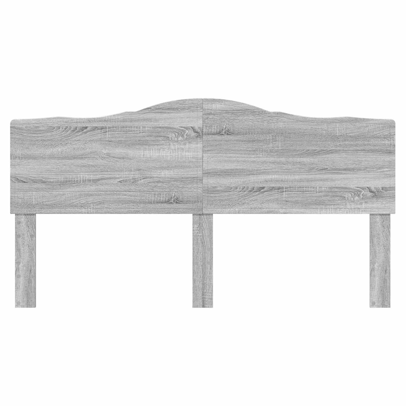 Hellgraues Holzkopfteil mit gewölbtem Design in der oberen Mittelmitte, die sichtbare Holzmaserung aufweist, befestigt an zwei Stützbeinen.