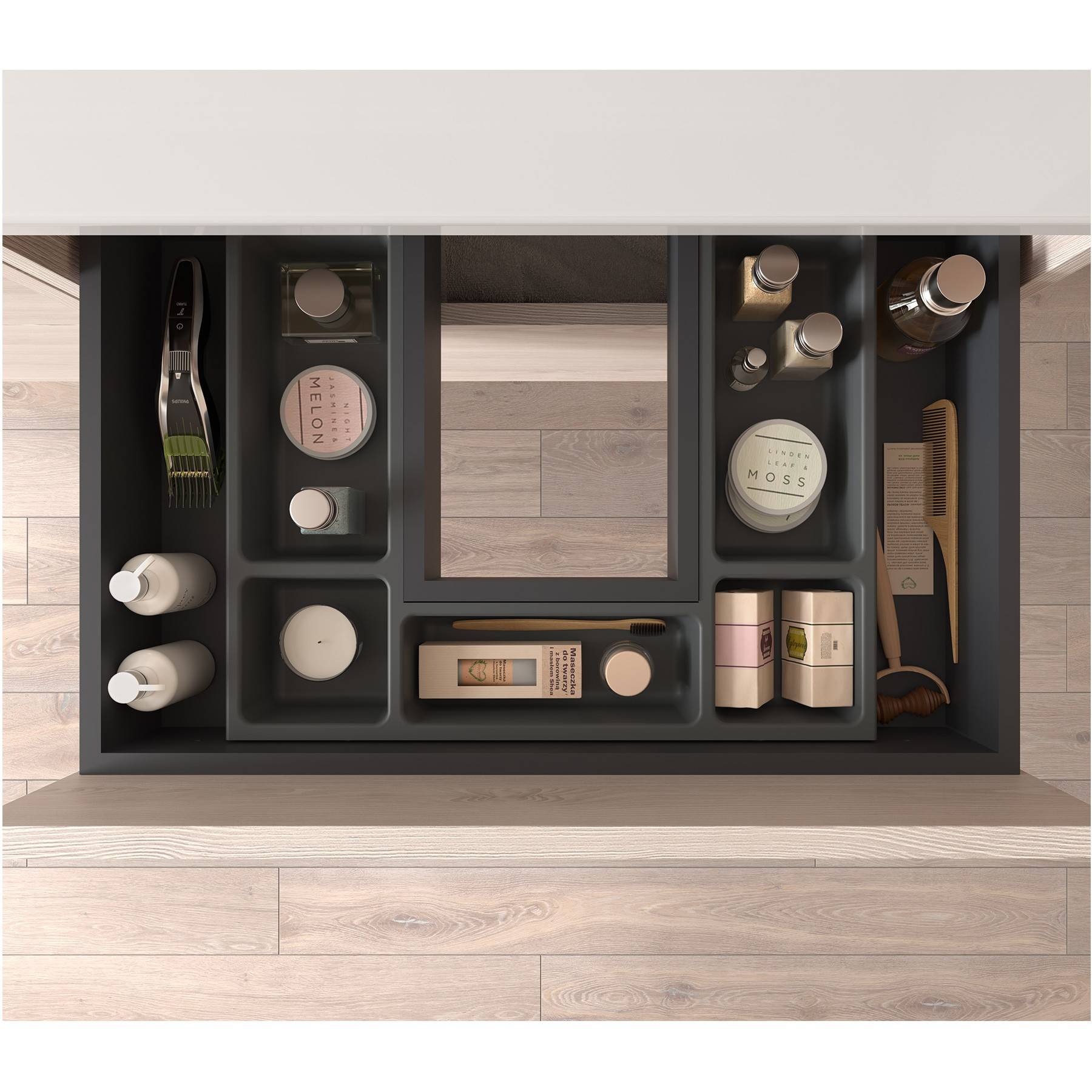 Eine übersichtlich angeordnete Schublade mit verschiedenen Hautpflegeprodukten, Kerzen, Pinseln und einem sichtbaren Pinselgriff aus einer Draufsicht.