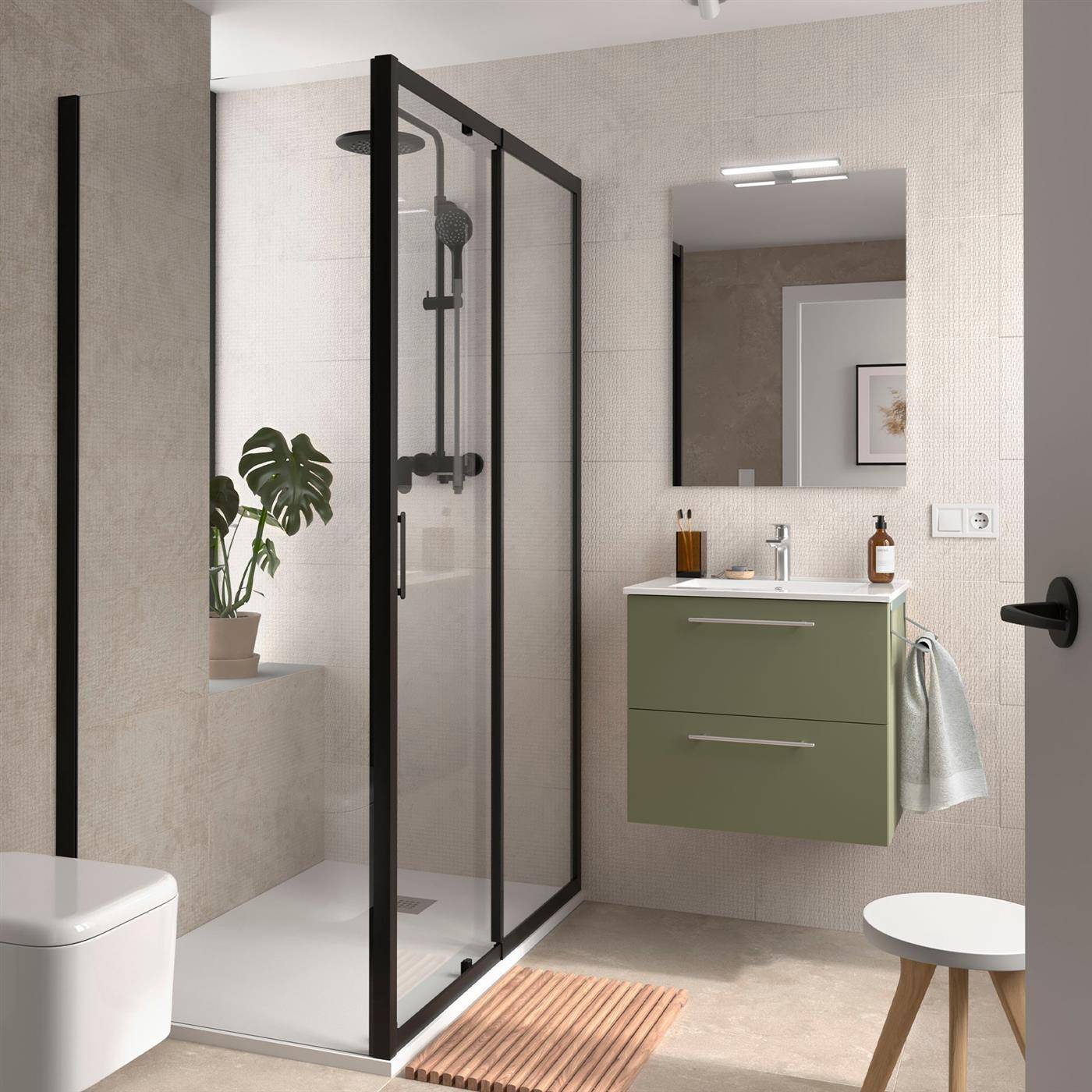 Modernes Badezimmer mit schwarzgerahmter Glasdusche, schwebendem grünem Waschtisch, Spiegel, Toilette, Pflanze und kleinem Hocker.