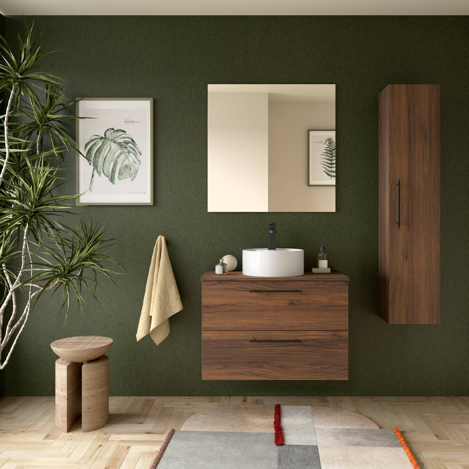 Modernes Badezimmer mit einer Holz-Waschtischplatte, rundem weißen Waschbecken und einem wandmontiertem Schrank. Grüne Wand mit einer Pflanze und gerahmter Kunstwerk.