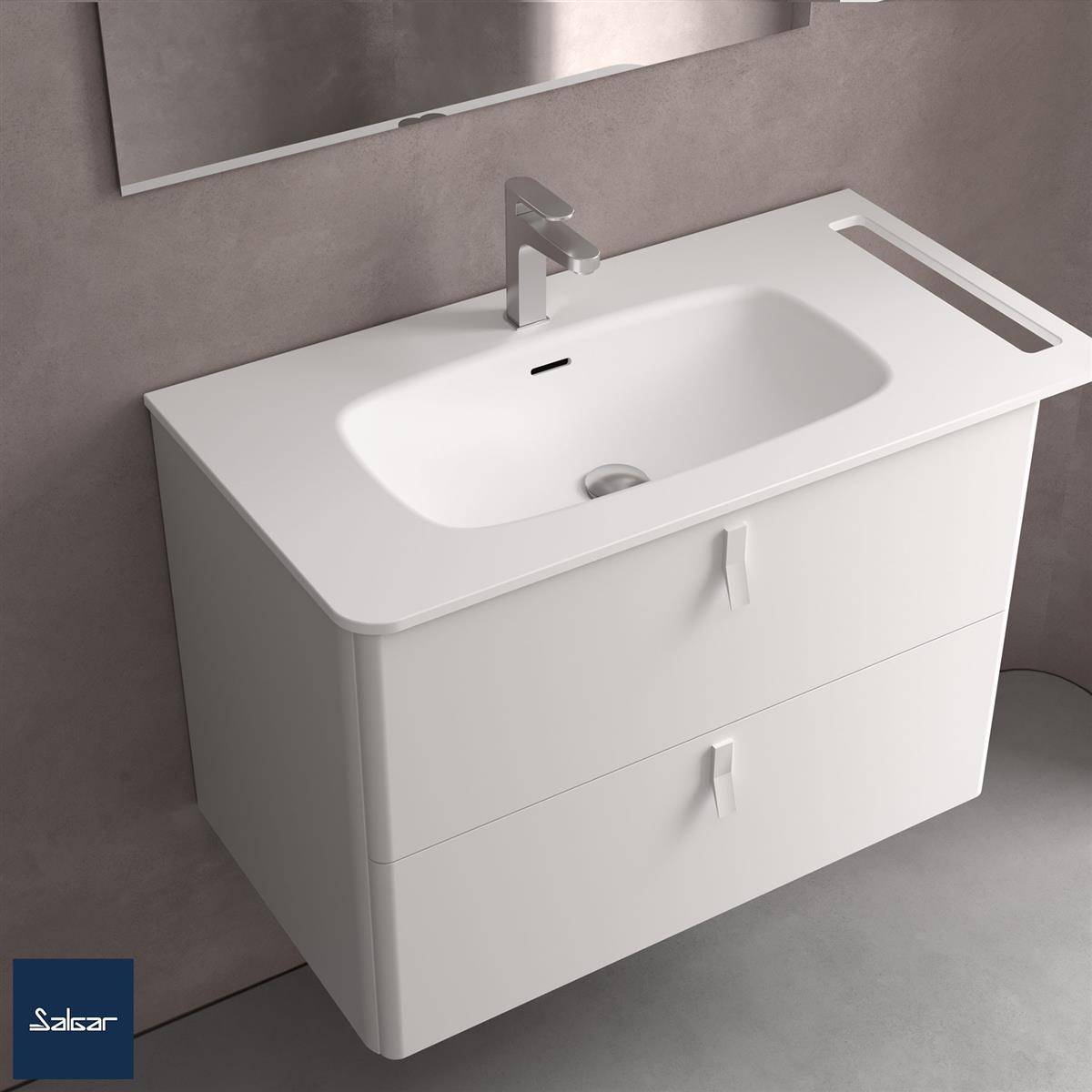 Modernes weiß wandmontiertes Badezimmerwaschtisch mit integriertem Waschbecken, einzelnem Wasserhahn, zwei Schubladen und seitlichem Handtuchhalter gegen eine graue Wand.