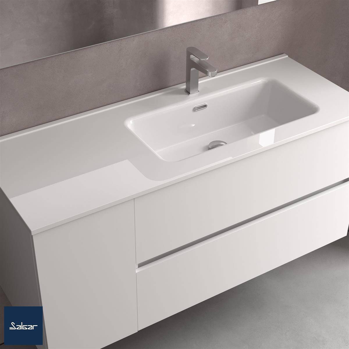 Modernes weißes Badezimmerwaschtisch mit integriertem Waschbecken, einzelnem Wasserhahn und großer Schublade an einer grauen Wand.
