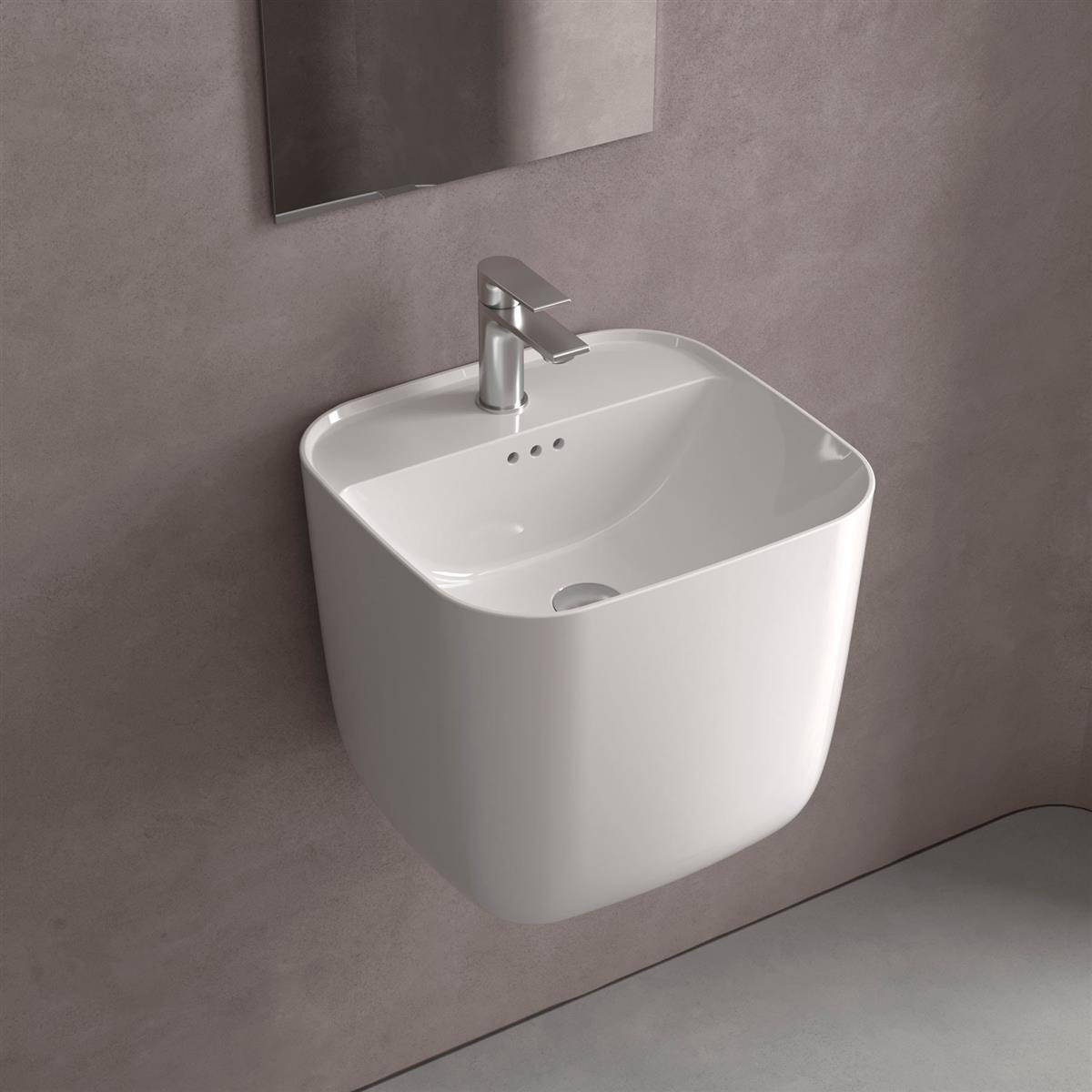 Wandmontiertes weißes Keramikwaschbecken mit Chromarmatur in einem minimalistischen Badezimmer vor einer grauen Wand.