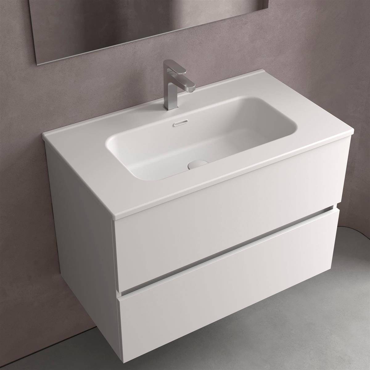 Modernes weiß wandmontiertes Badezimmer-Waschtisch mit integriertem Waschbecken und einhebel-Armatur vor einer grauen Wand.
