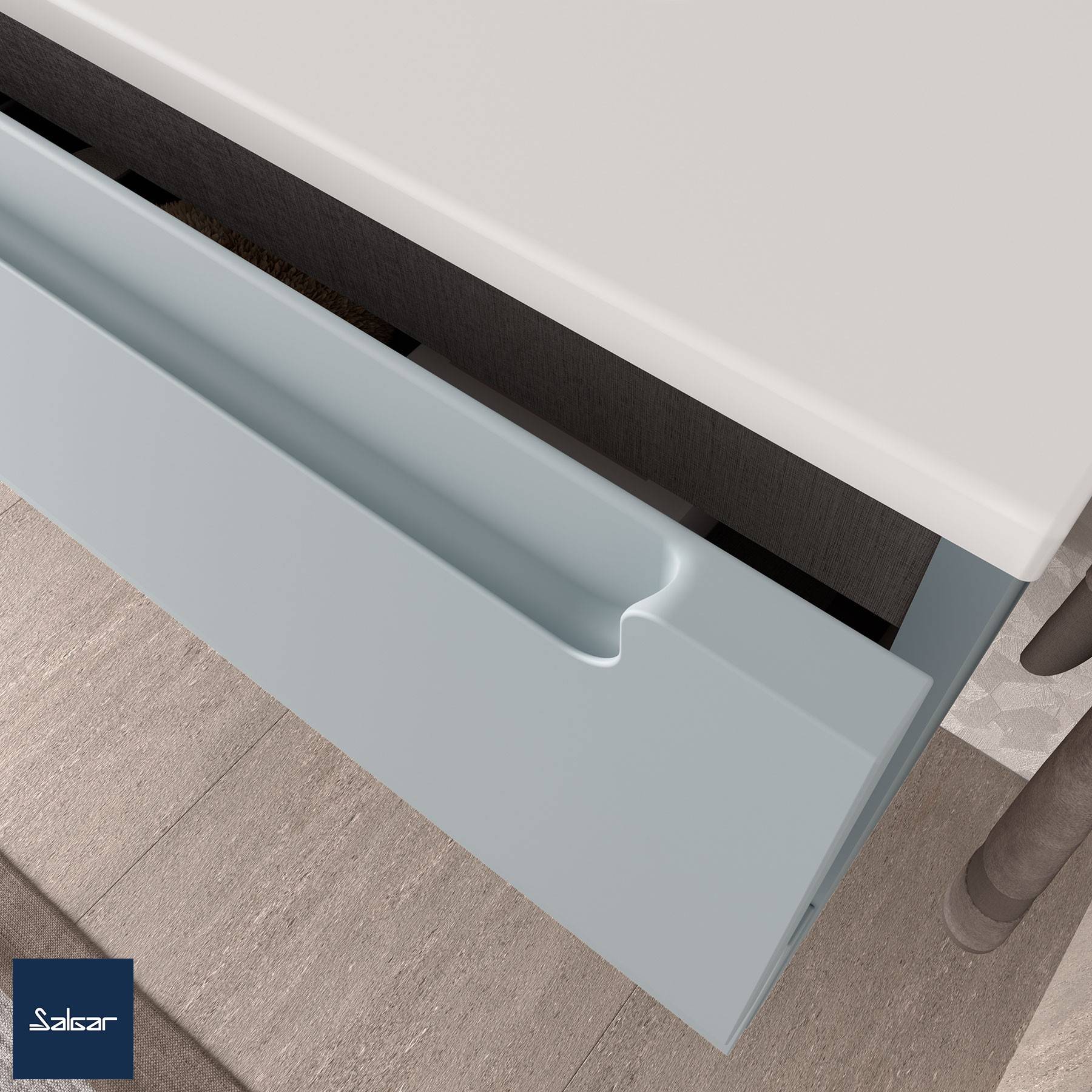 Teilansicht eines grauen Badezimmerwaschtischs mit einem glatten, flachen Schubladengriff, der ein minimalistisches Design präsentiert. In der Ecke befindet sich ein Logo.