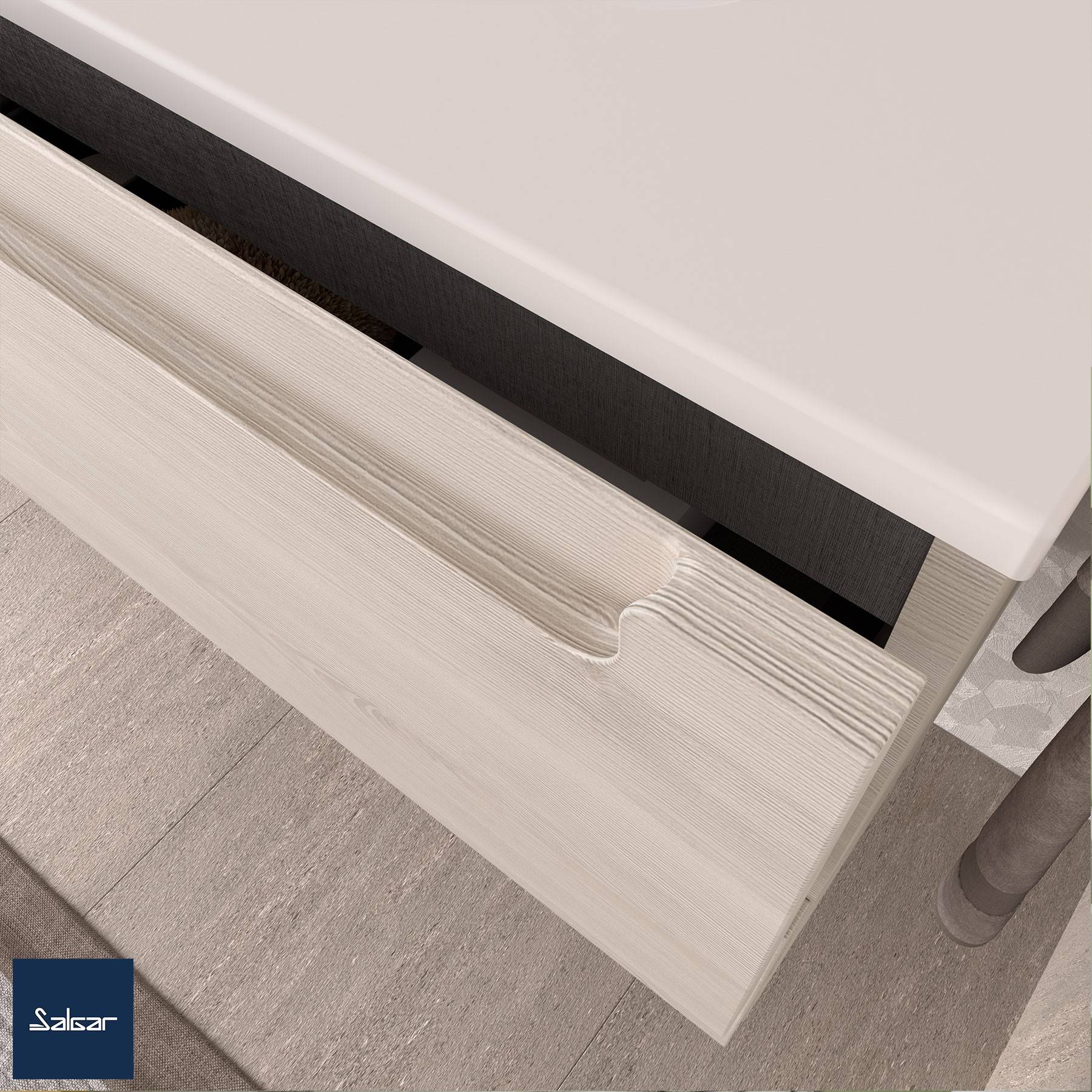 Eine Teilansicht eines hellholzfarbenen Schubladengriffs, der an einer Schublade unter einer weißen Oberfläche befestigt ist, mit gefliesten Bodenfliesen, die darunter sichtbar sind.