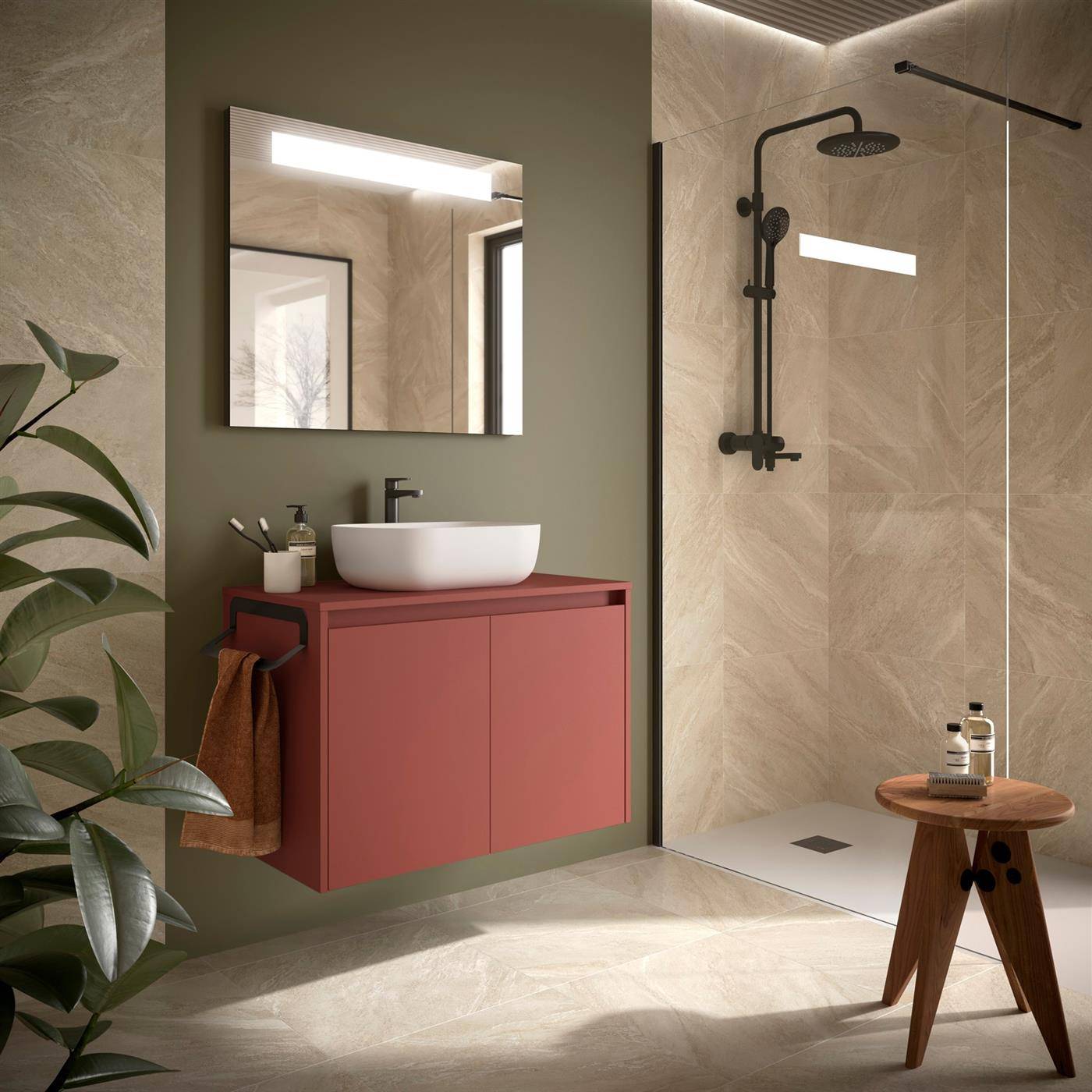 Modernes Badezimmer mit olivgrüner Wand, schwebendem rotem Waschtisch, rundem Waschbecken und Spiegel, sowie begehbarer Dusche mit schwarzen Armaturen und kleinem Holzhocker.