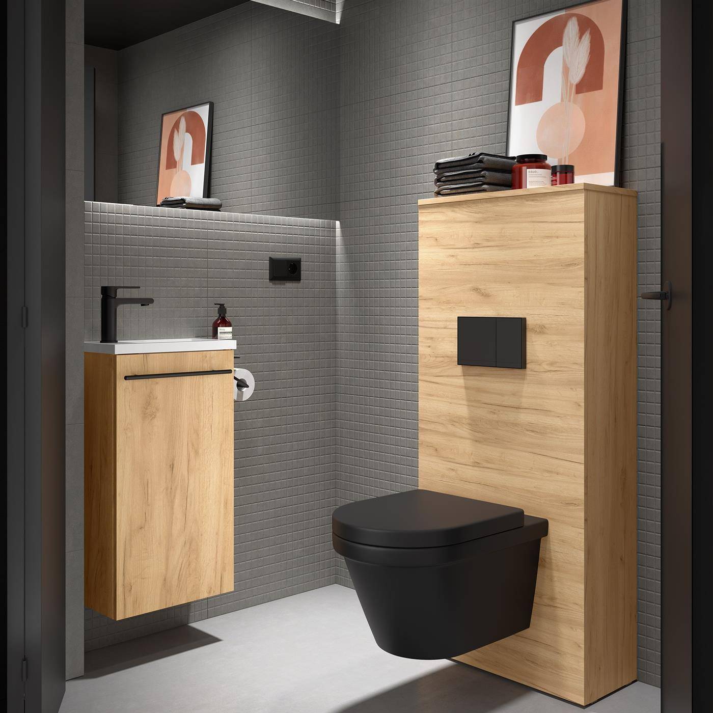 Modernes Badezimmer mit an der Wand montiertem Waschbecken und schwarzer Toilette neben einem Schrank aus hellem Holz, grau gefliesten Wänden und gerahmter abstrakter Kunst.