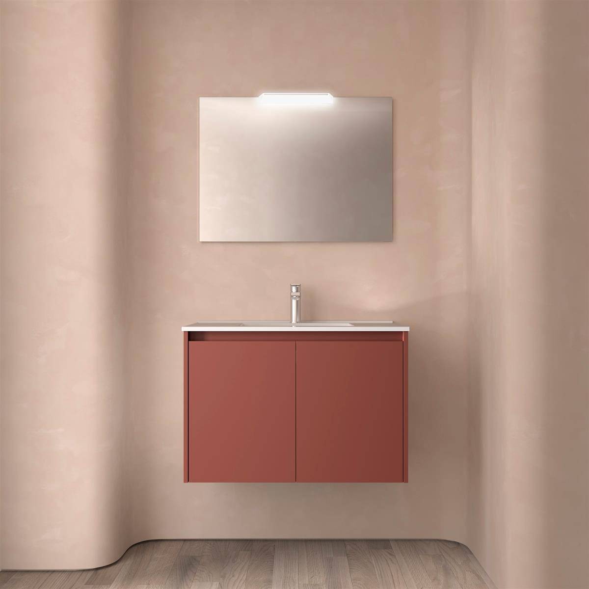 Minimalistisches Badezimmerwaschbecken mit rotem wandmontiertem Schrank, Waschbecken und Spiegel vor beiger geschwungener Wand.