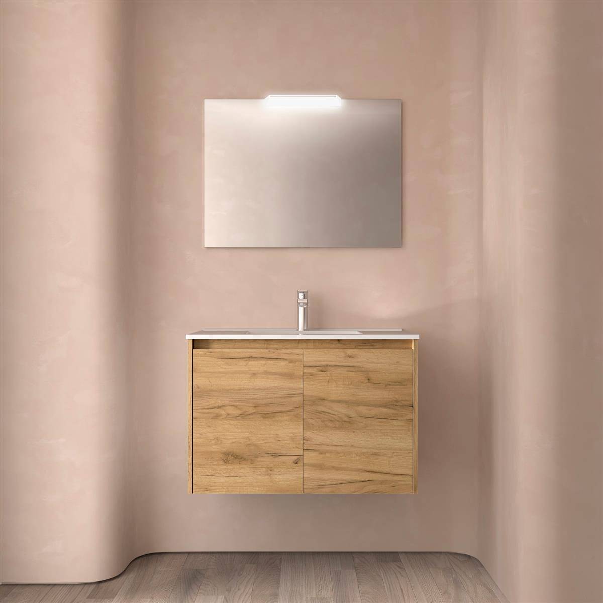 Minimalistische Badezimmereitelkeit mit Holzschrank, Waschbecken, Wasserhahn und beleuchtetem Spiegel vor einer beigen Wand.