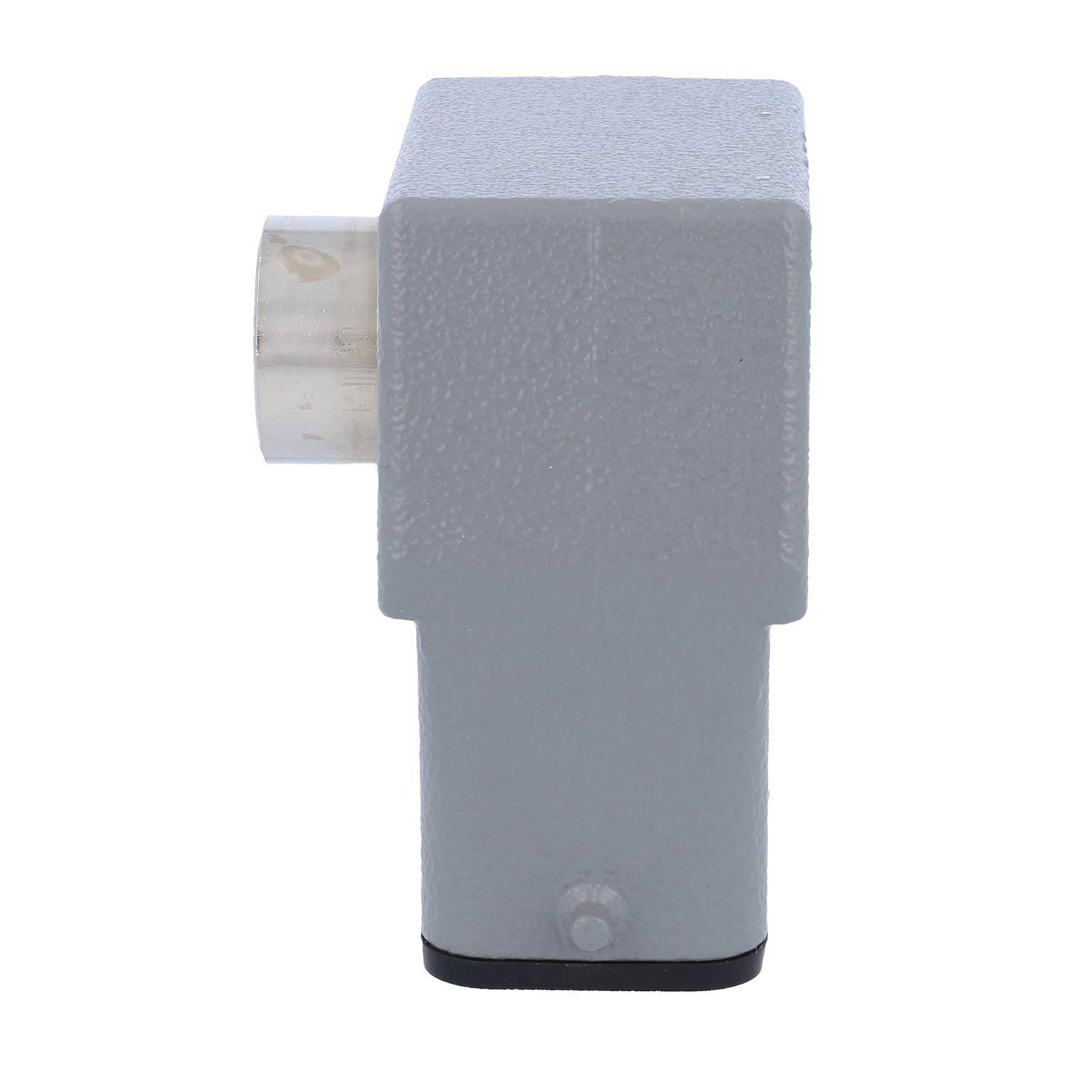 Ein grauer Metallgegenstand mit rechteckiger Form und einem hervorstehenden kreisförmigen Element an einer Seite. Wirkt robust und industriell.