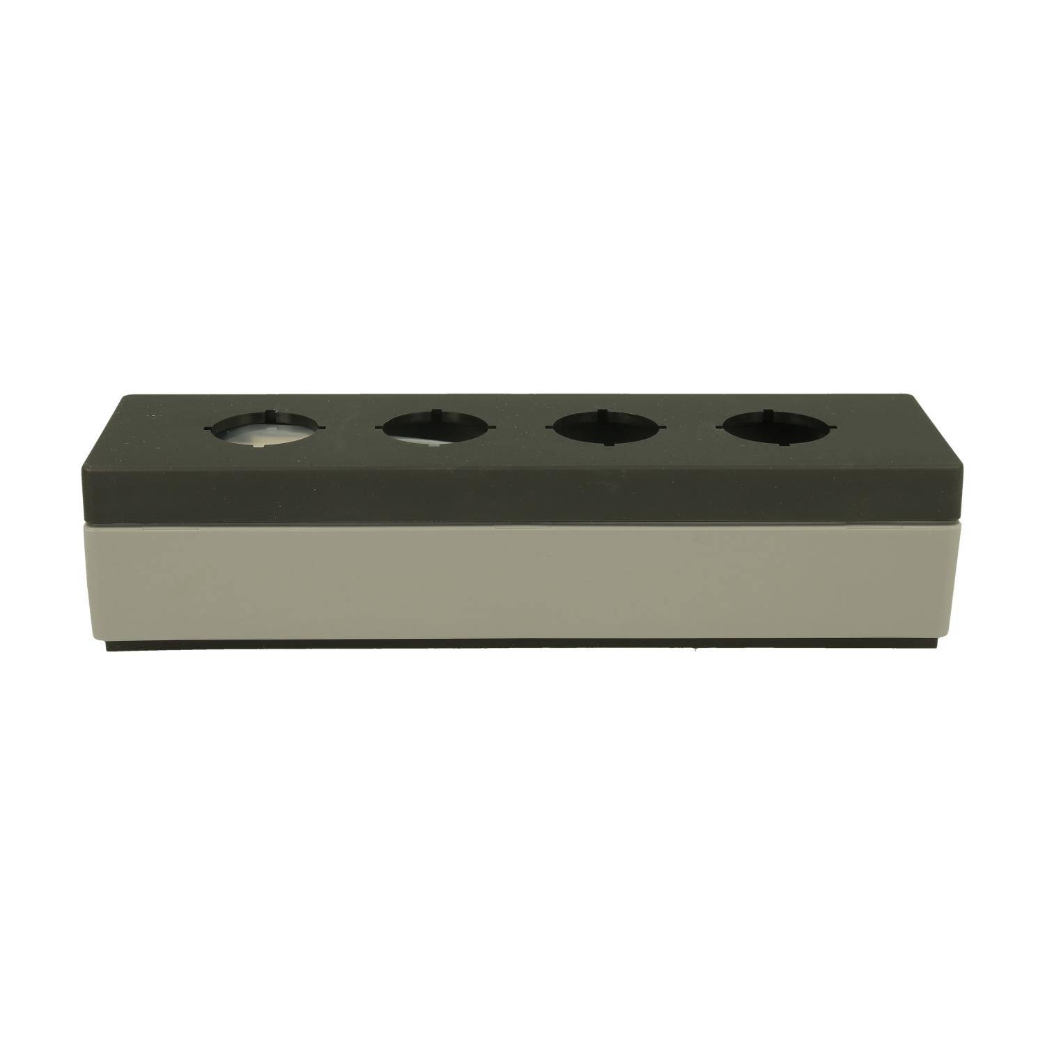 Ein rechteckiger schwarzer und grauer Block mit vier kreisförmigen Löchern auf der Oberseite, der wie ein Kabelmanagement- oder modulares Verbindungsgerät aussieht.