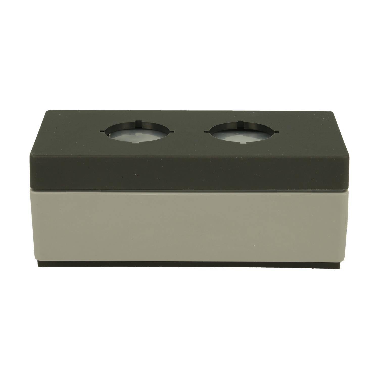 Eine rechteckige Kunststoffgehäuse mit zwei kreisförmigen Öffnungen auf der Oberseite, konstruiert zur Aufnahme von elektrischen Komponenten oder Schaltern.